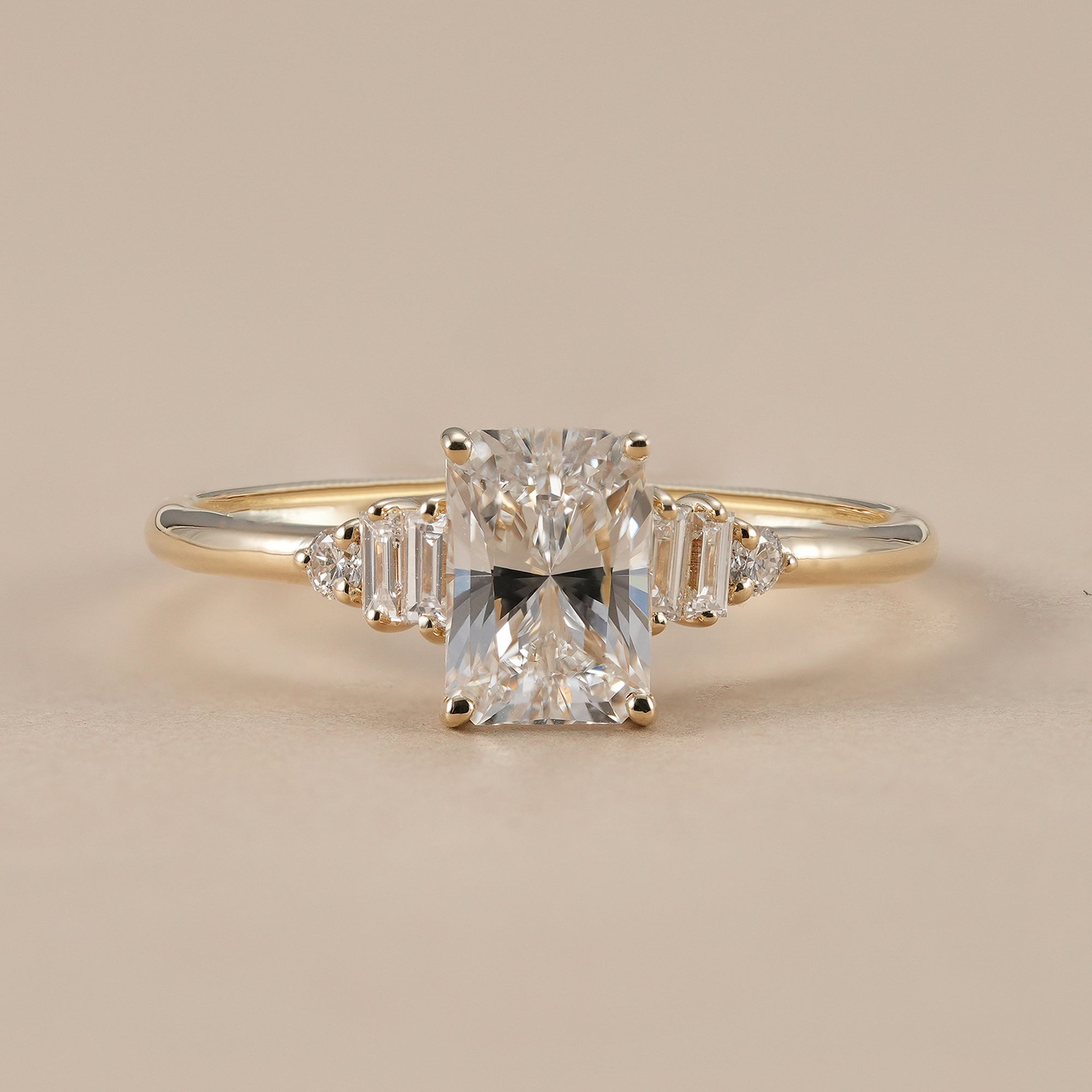 Radiant lab grown diamond engagement ring with baguette side stones