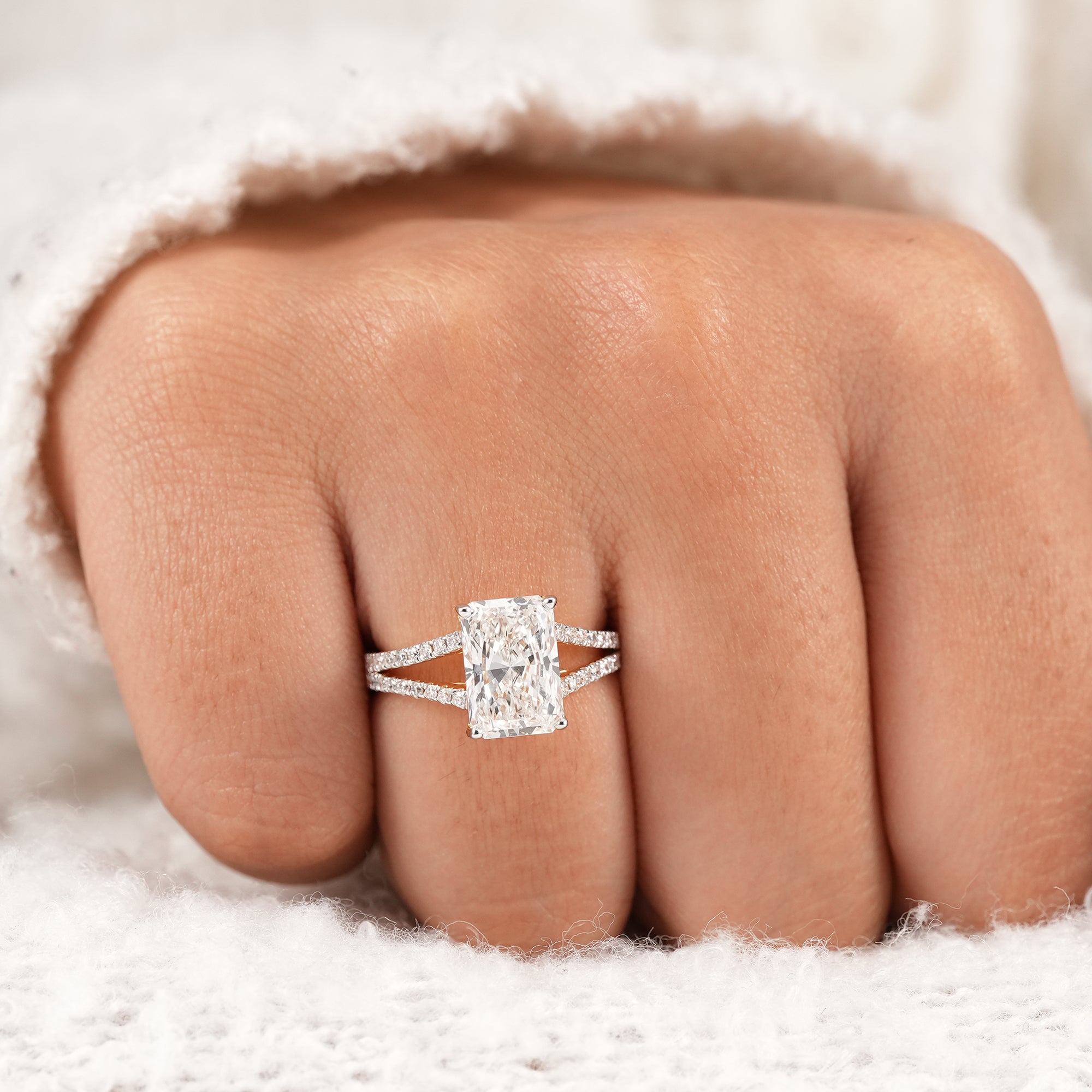 Contemporary radiant solitaire engagement ring with split band
