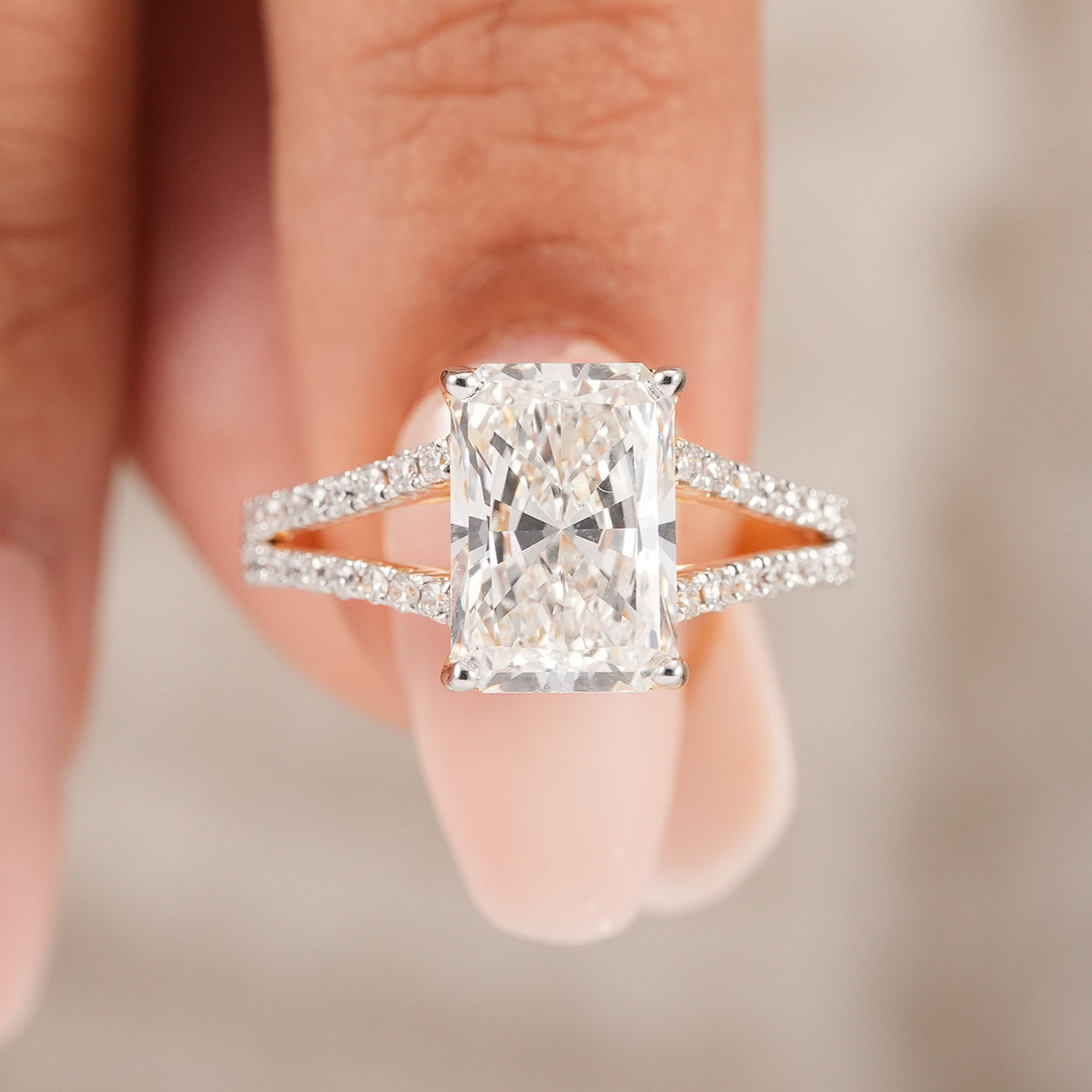 Radiant solitaire diamond ring featuring double split shank design
