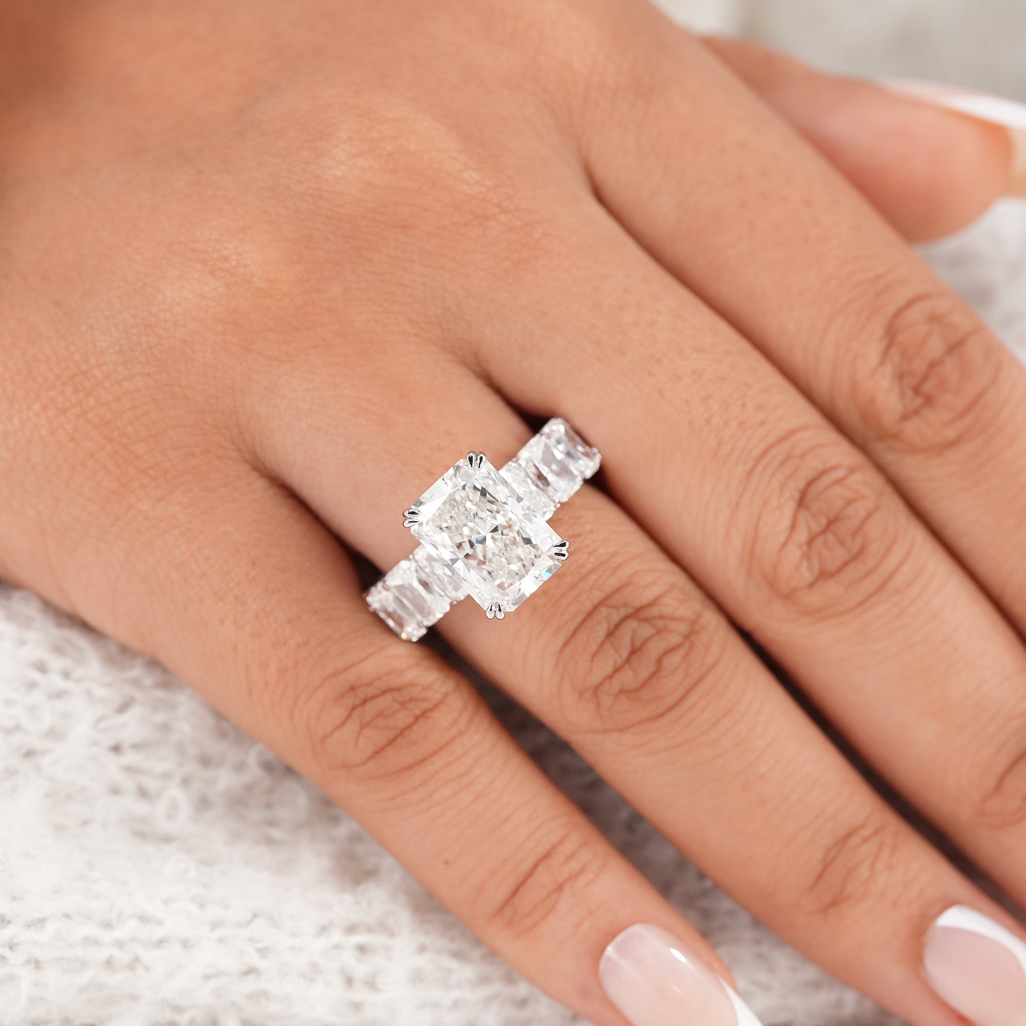 IGI certified radiant diamond engagement ring with side diamonds