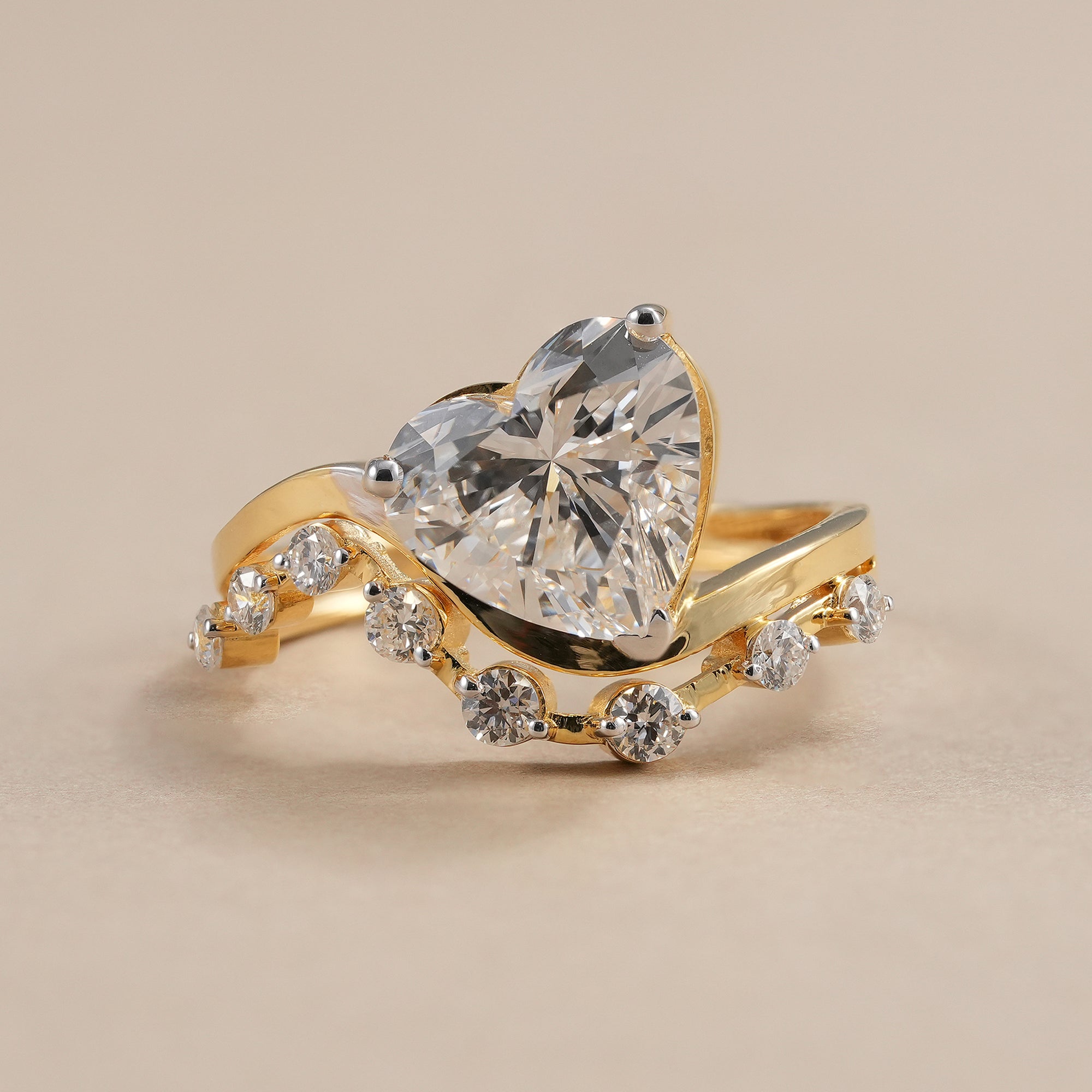 Heart diamond ring with lab grown diamond curved band in yellow gold.