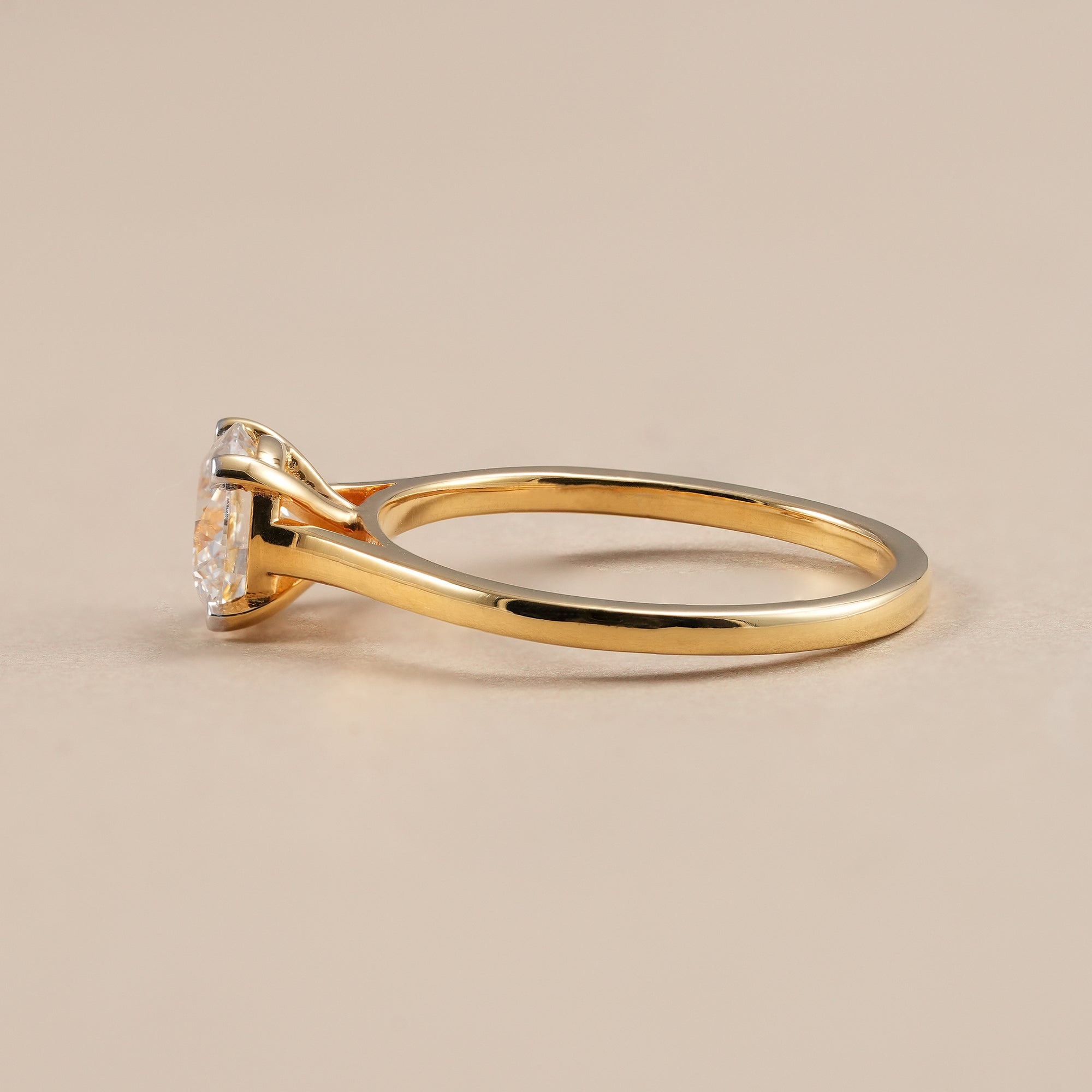 Four prong round lab diamond engagement ring in polished yellow gold