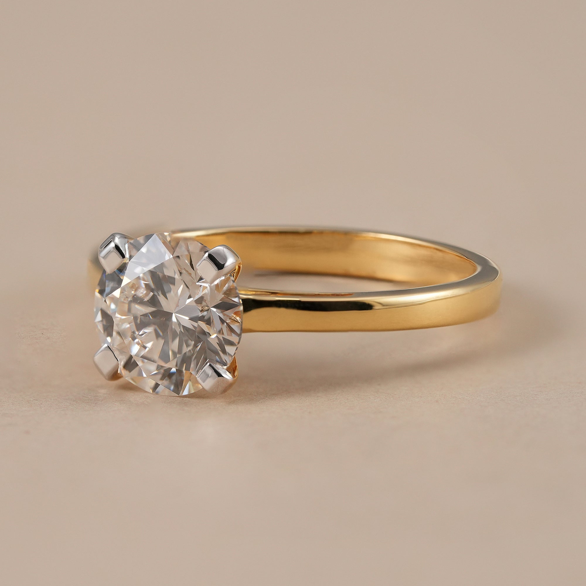Classic 4 prong round diamond engagement ring for women