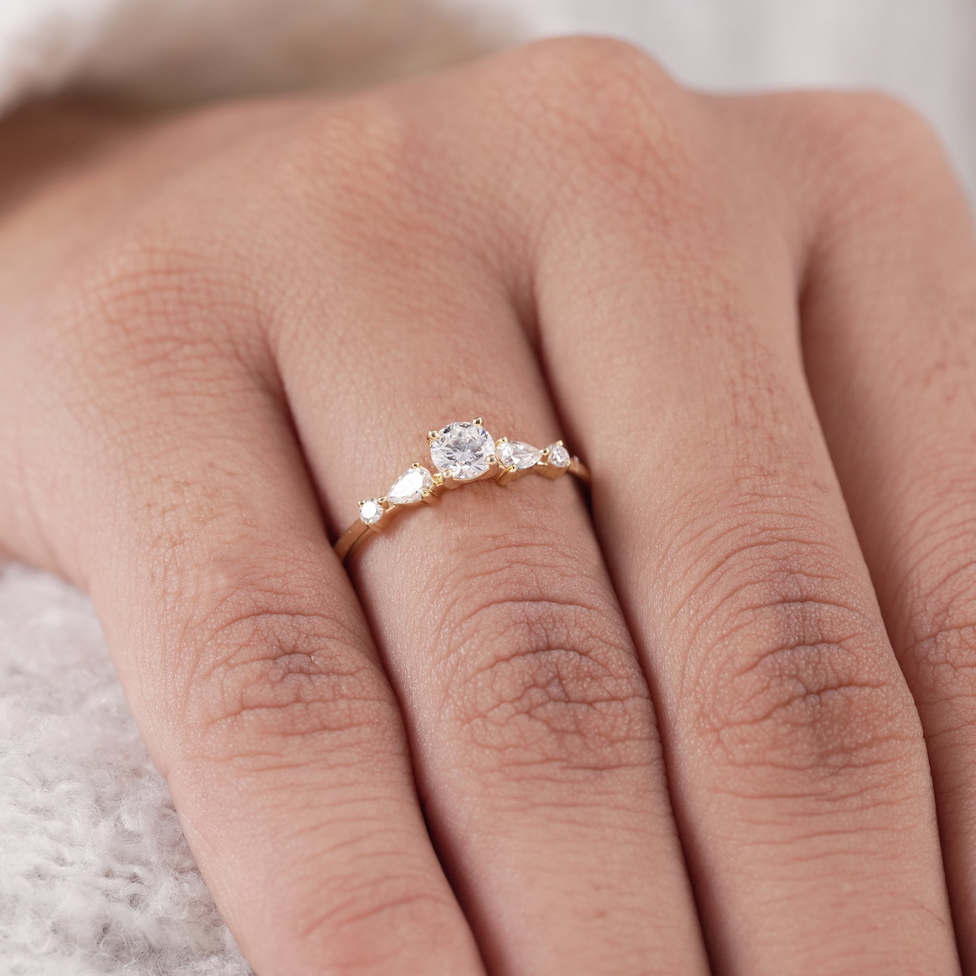 Delicate minimalist diamond ring with pear accents