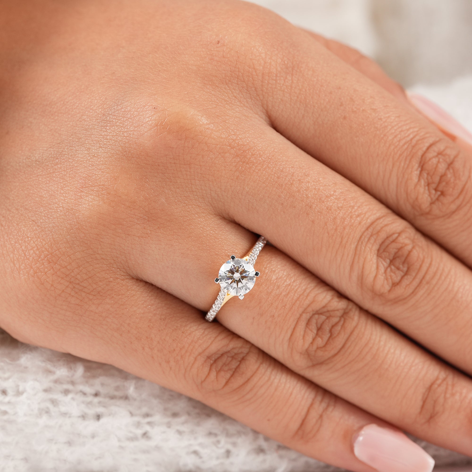 Round solitaire lab diamond ring featuring pavé shank