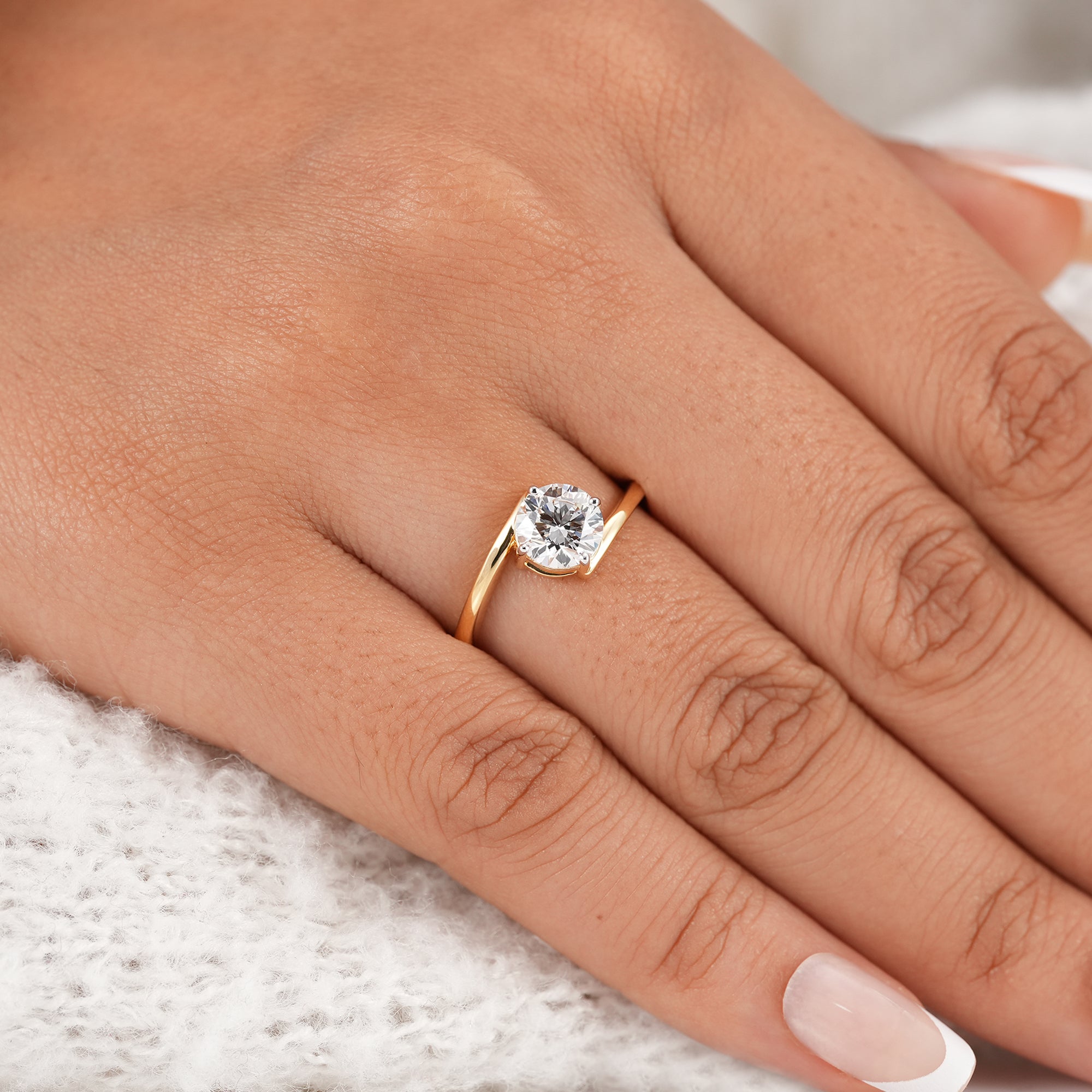 Round cut lab diamond ring with open bypass band