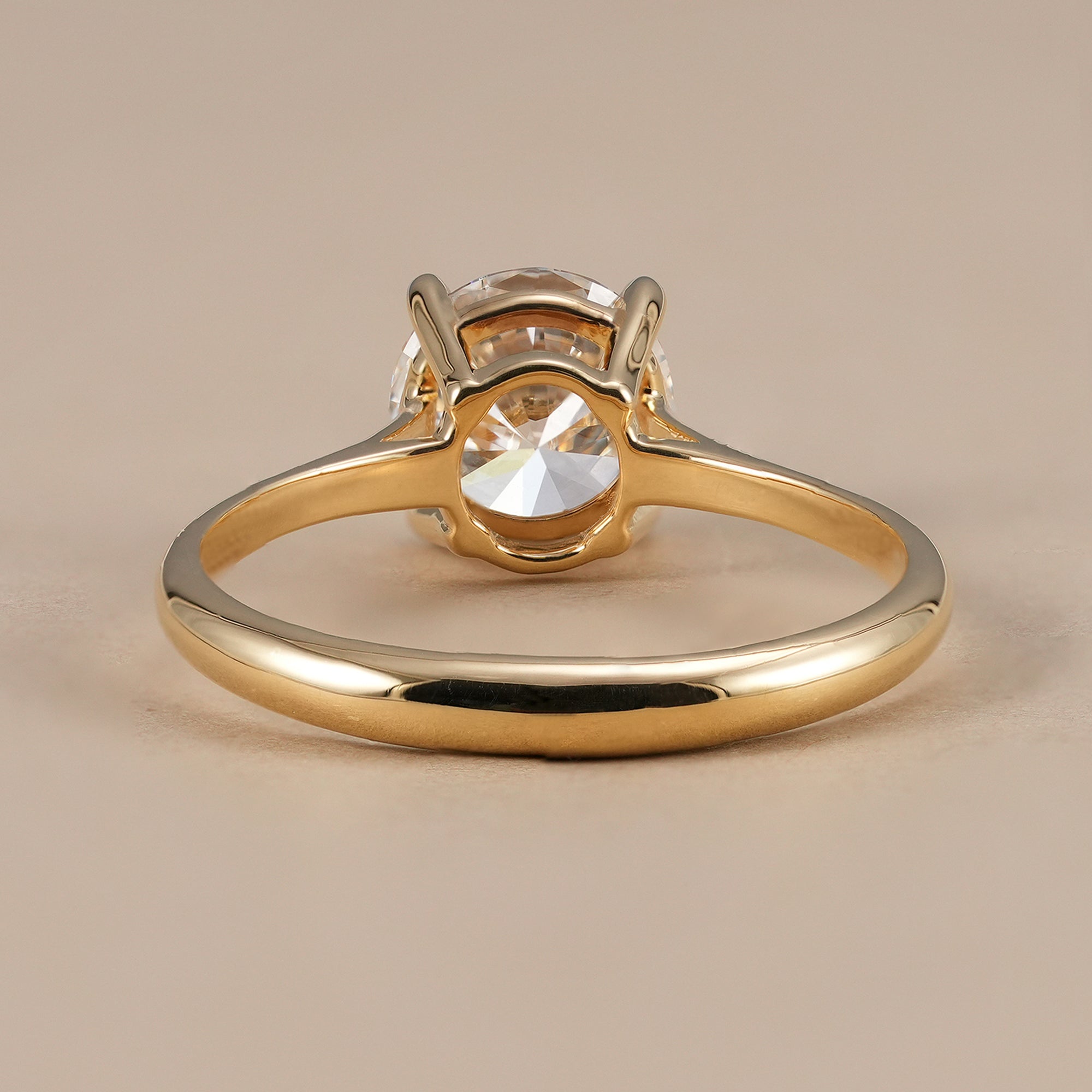 Women's round diamond proposal ring with cathedral shoulders