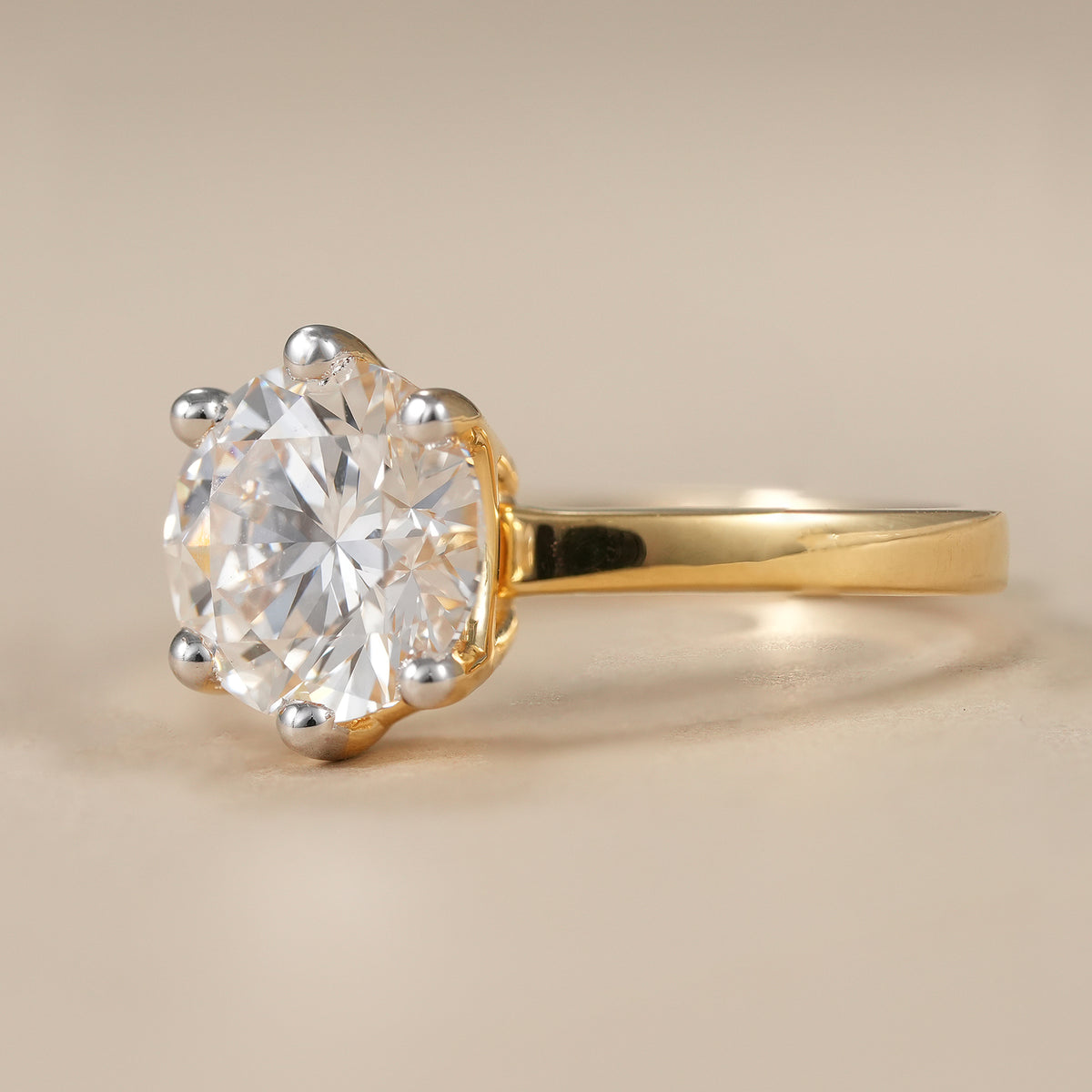 Elegant round brilliant lab diamond solitaire engagement ring handcrafted in yellow gold.