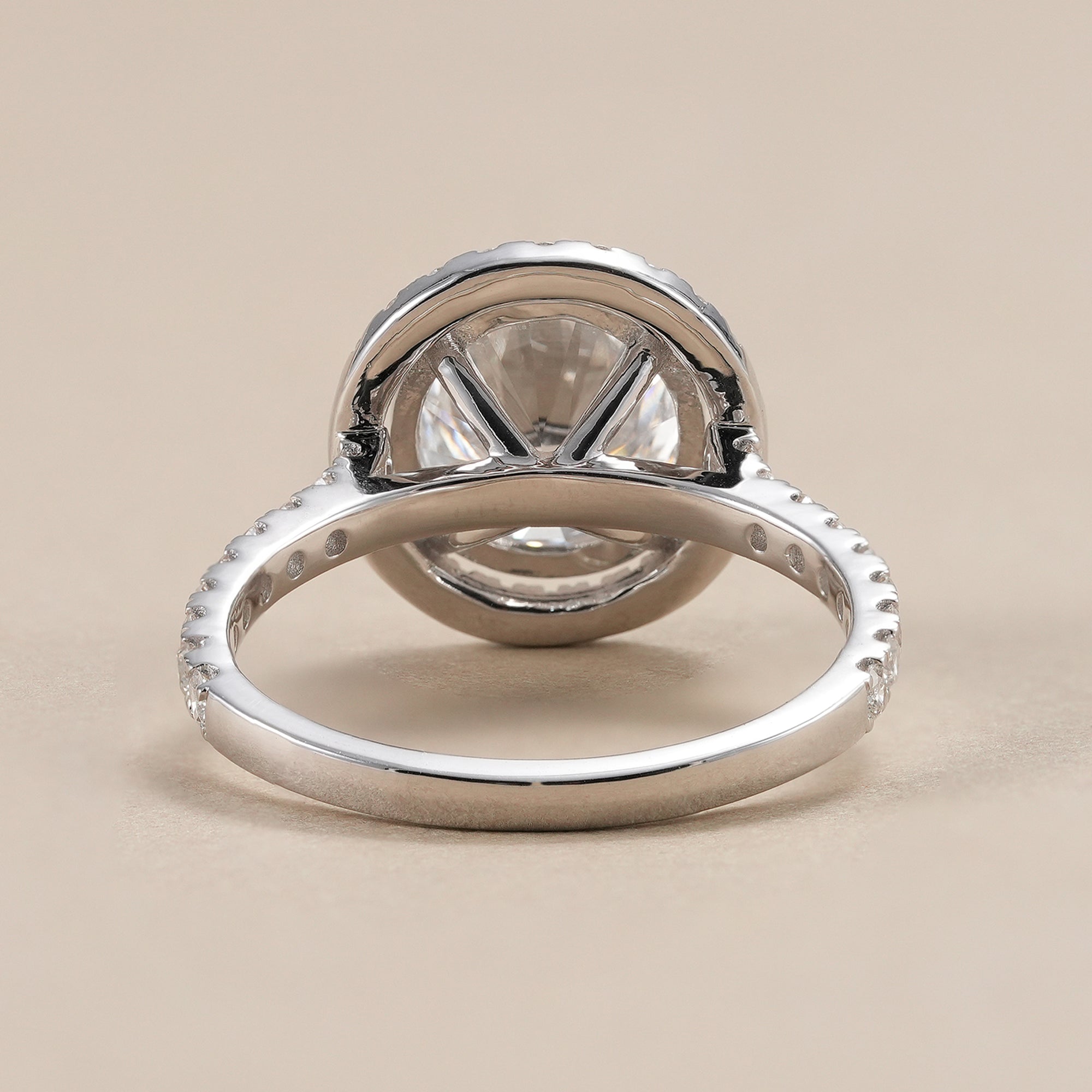 Luxury round lab diamond engagement ring with pavé band.