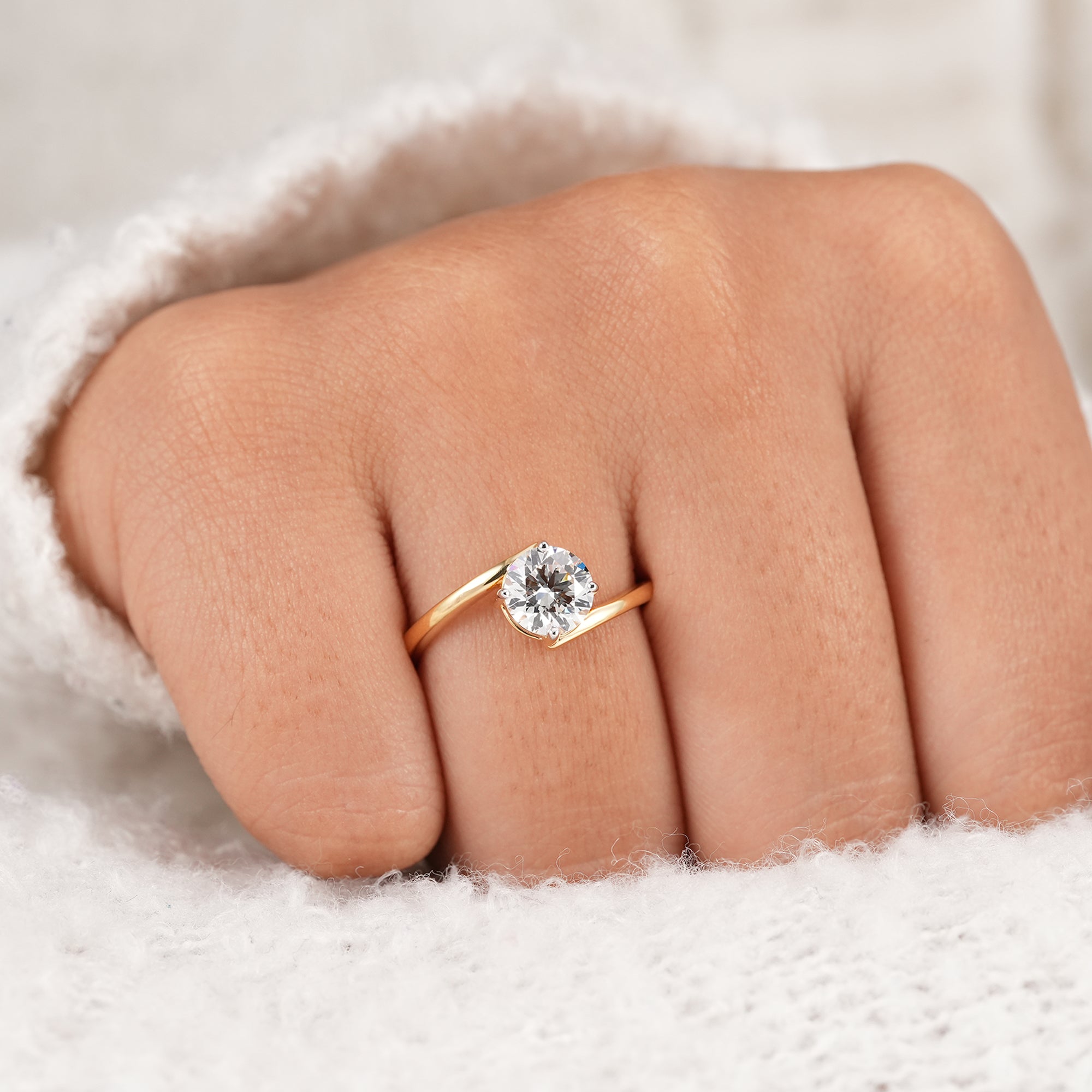 Contemporary round diamond proposal ring with bypass setting