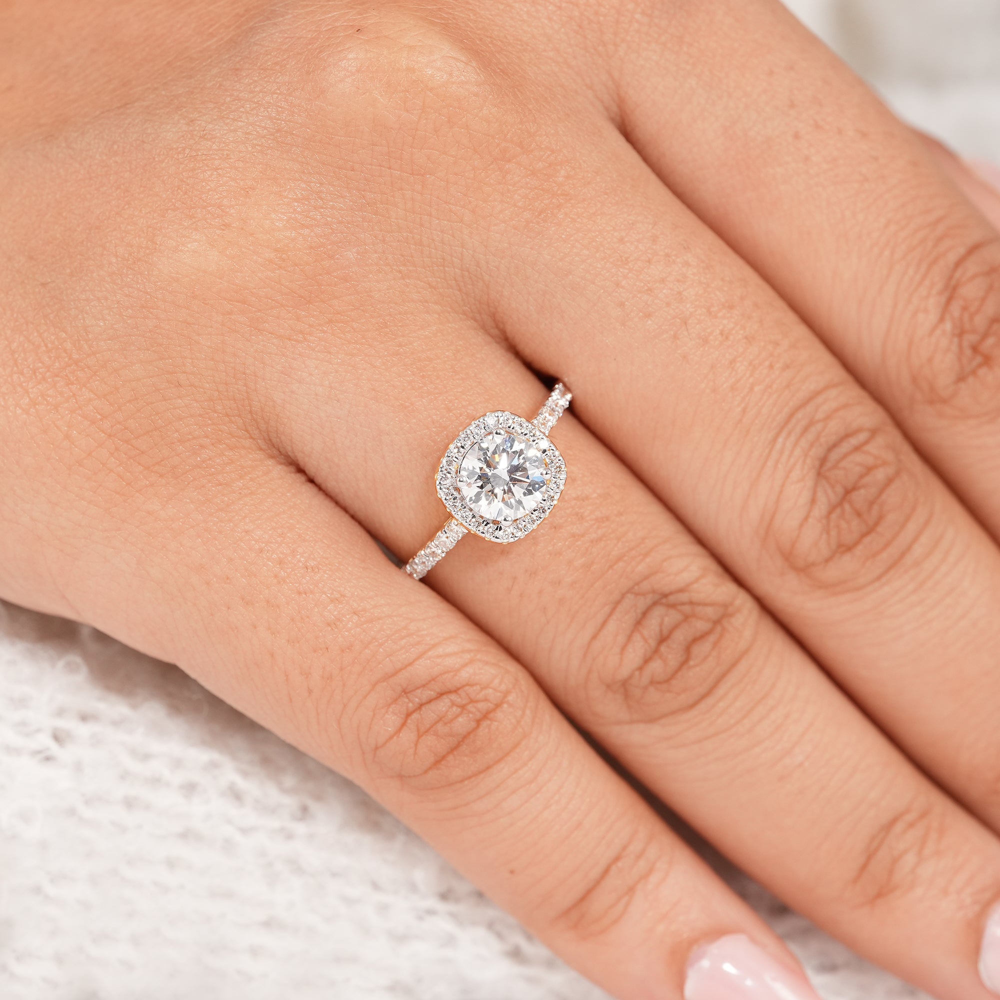 Four prong round diamond halo wedding ring