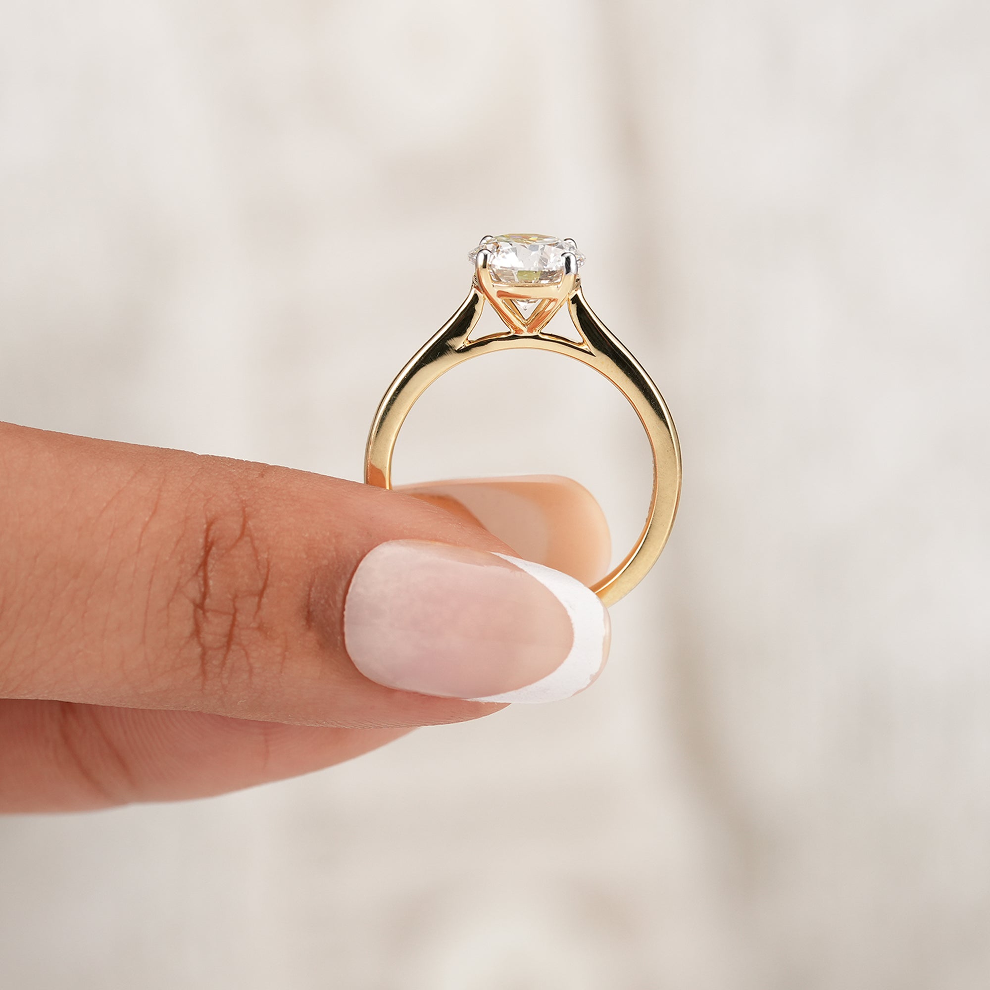 Round diamond solitaire cathedral ring for everyday wear