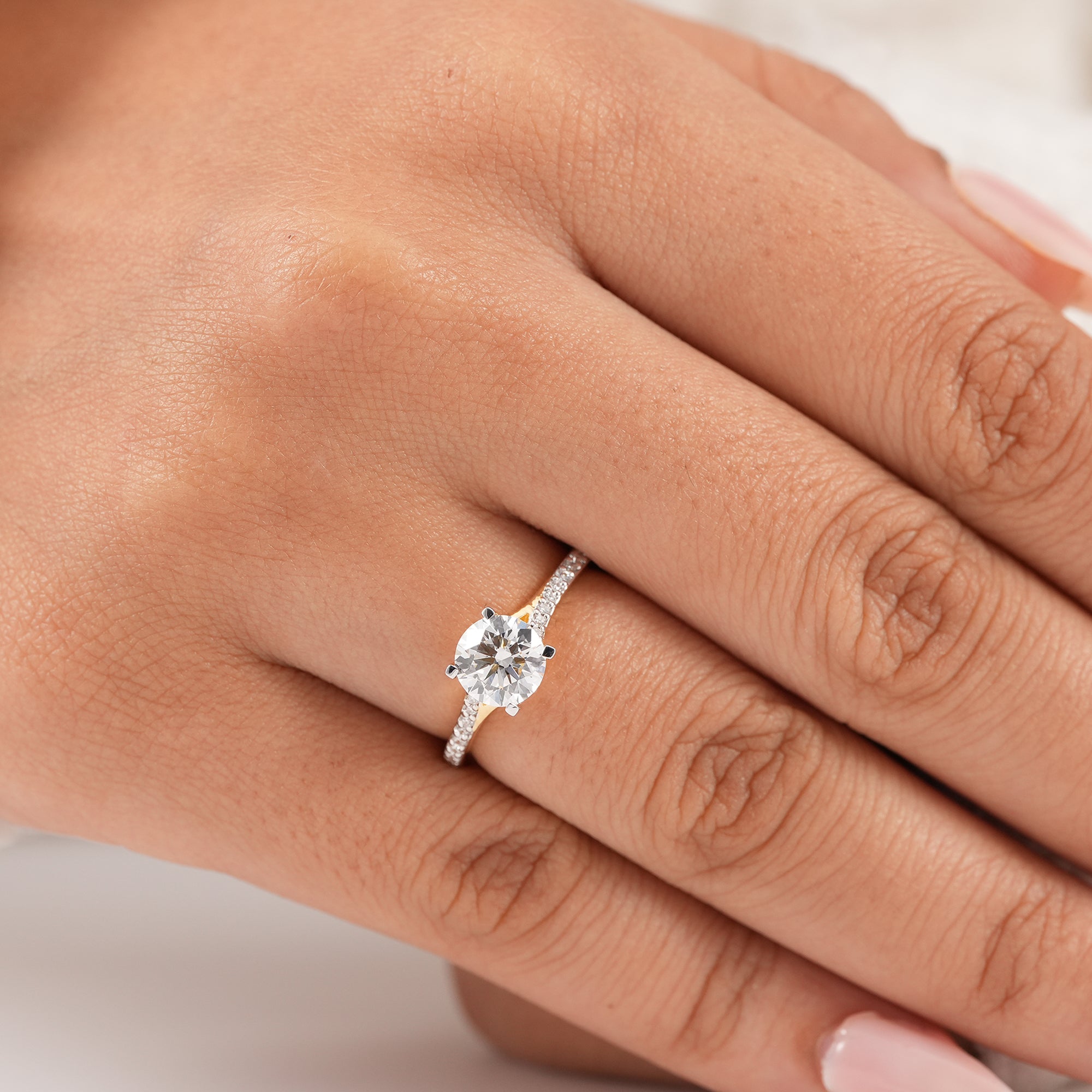 Women's round diamond wedding ring with pavé split band