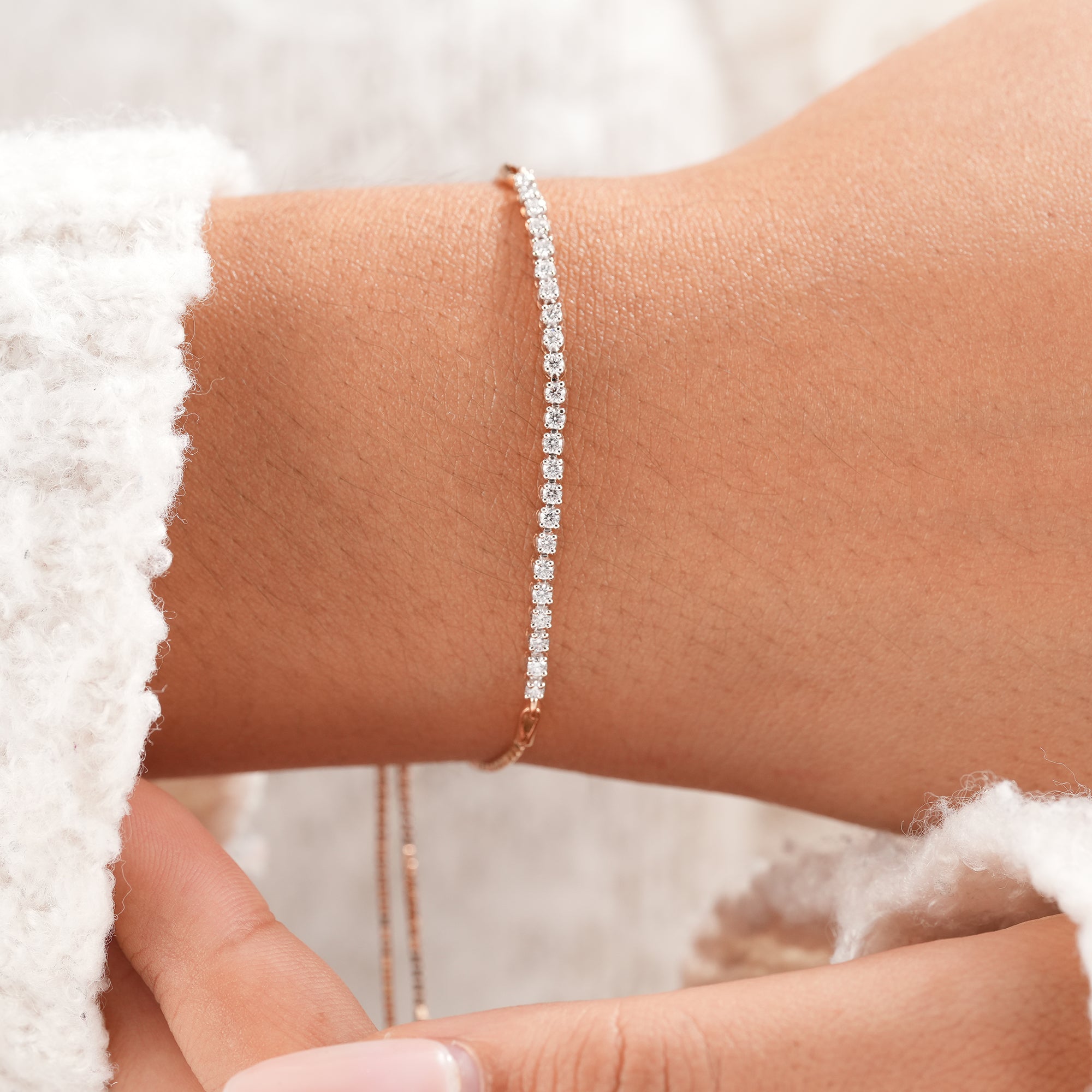 Round lab grown diamond bracelet featuring brilliant diamonds on an adjustable rose gold bolo chain.