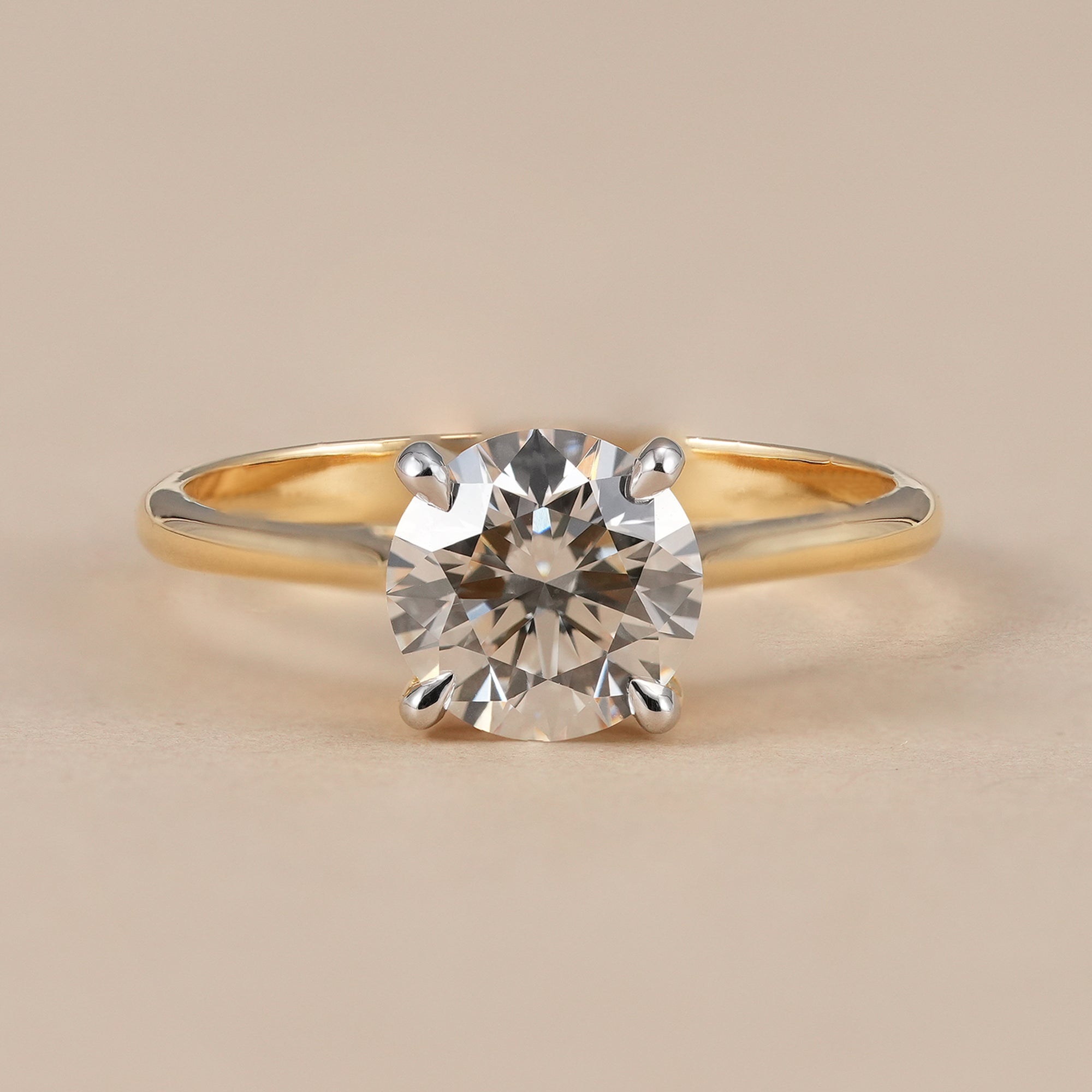 Round lab grown diamond cathedral engagement ring in solid yellow gold