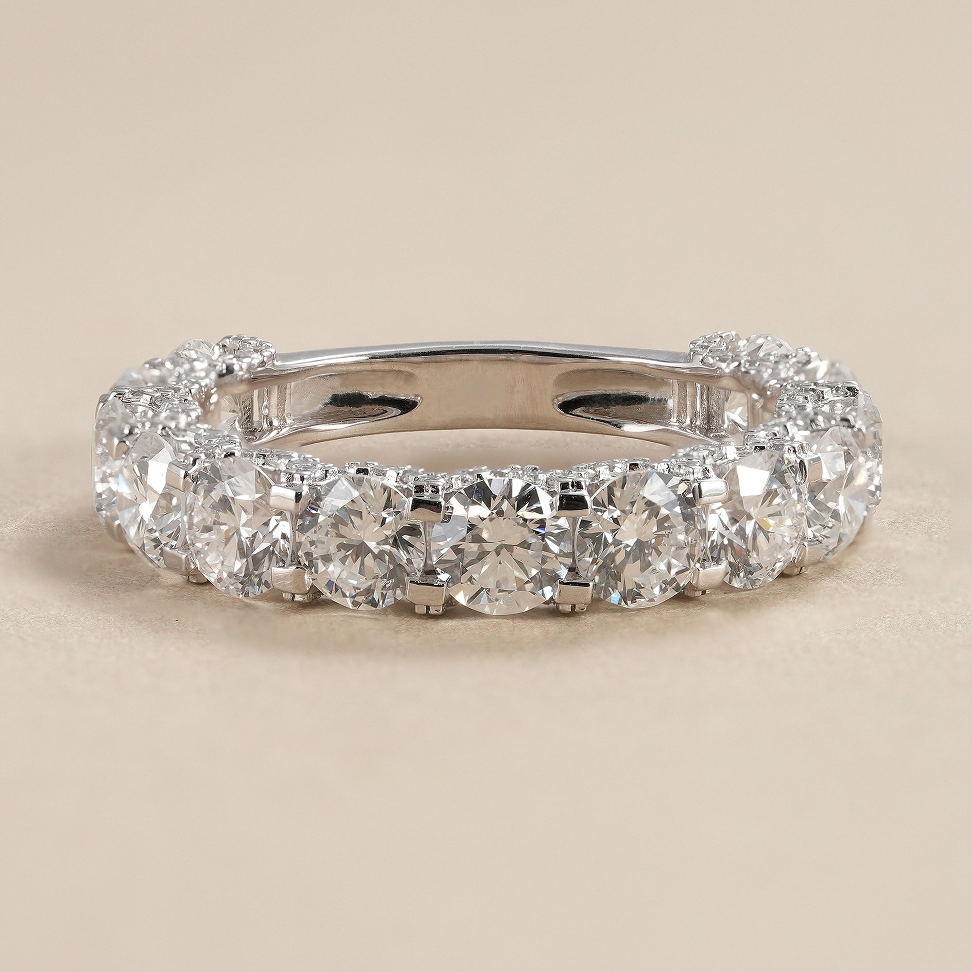 Round lab grown diamond eternity ring featuring IGI certified diamonds in a full wedding band design crafted in solid white gold.