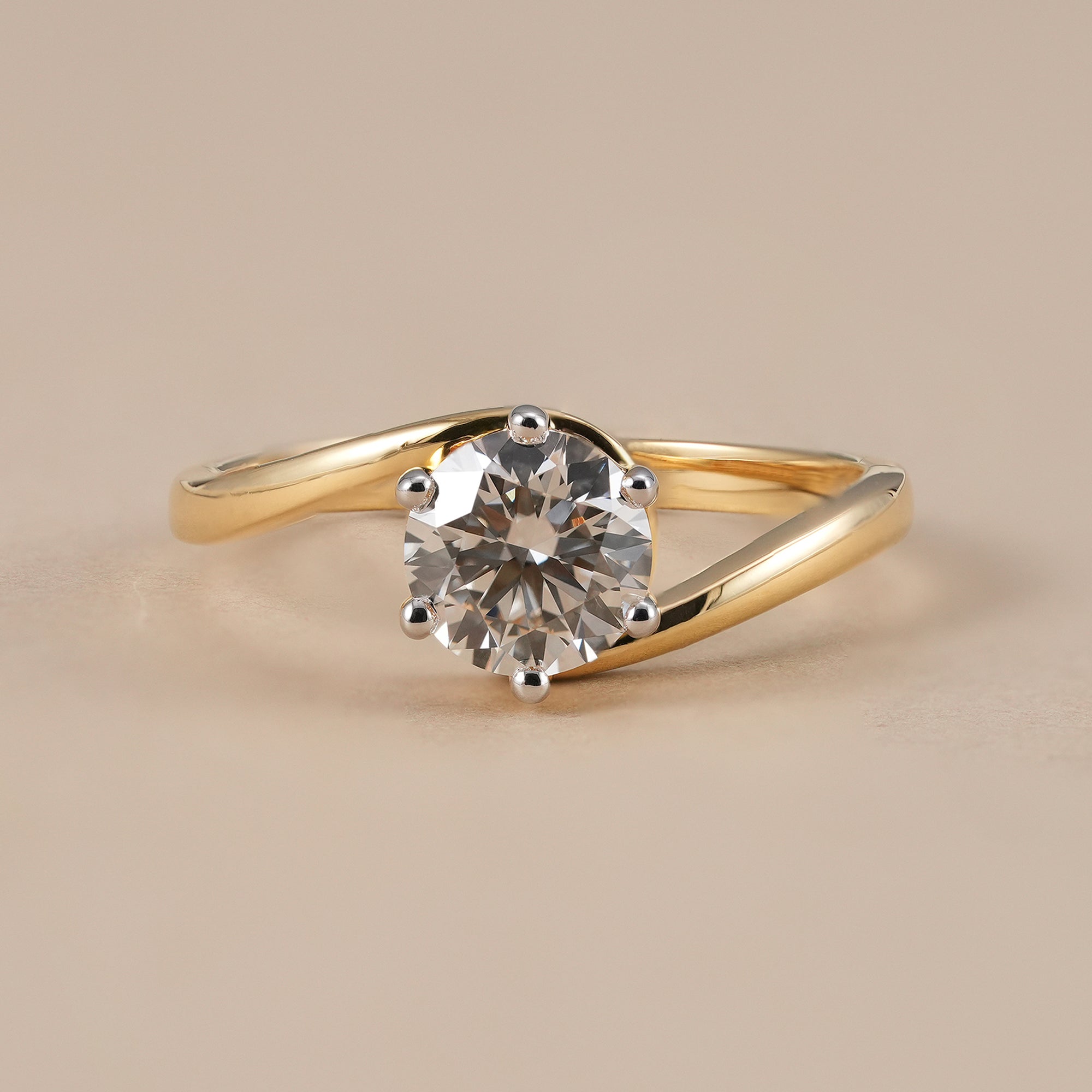 Round lab grown diamond open bypass engagement ring in yellow gold