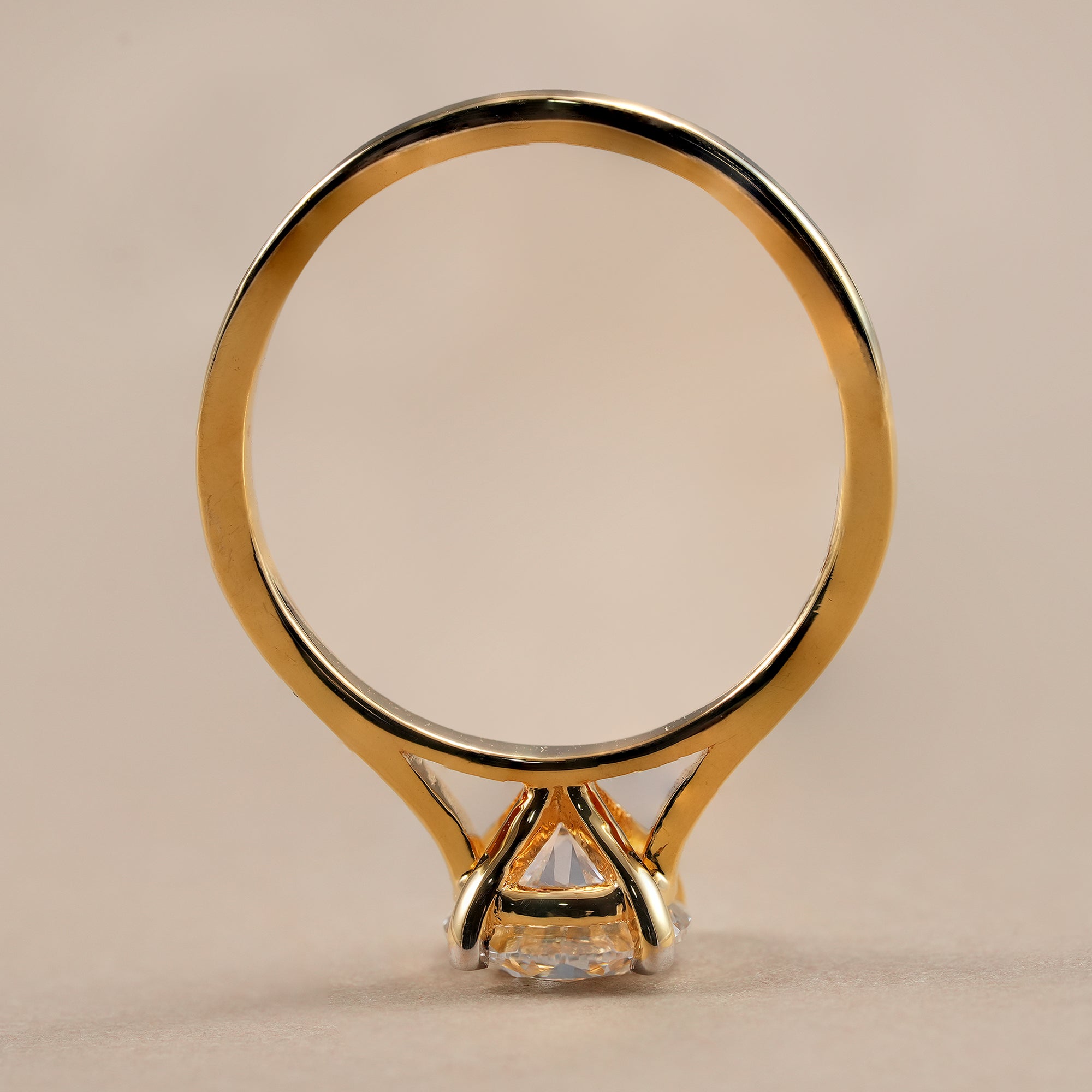 Classic round engagement ring with secure four prong solitaire setting