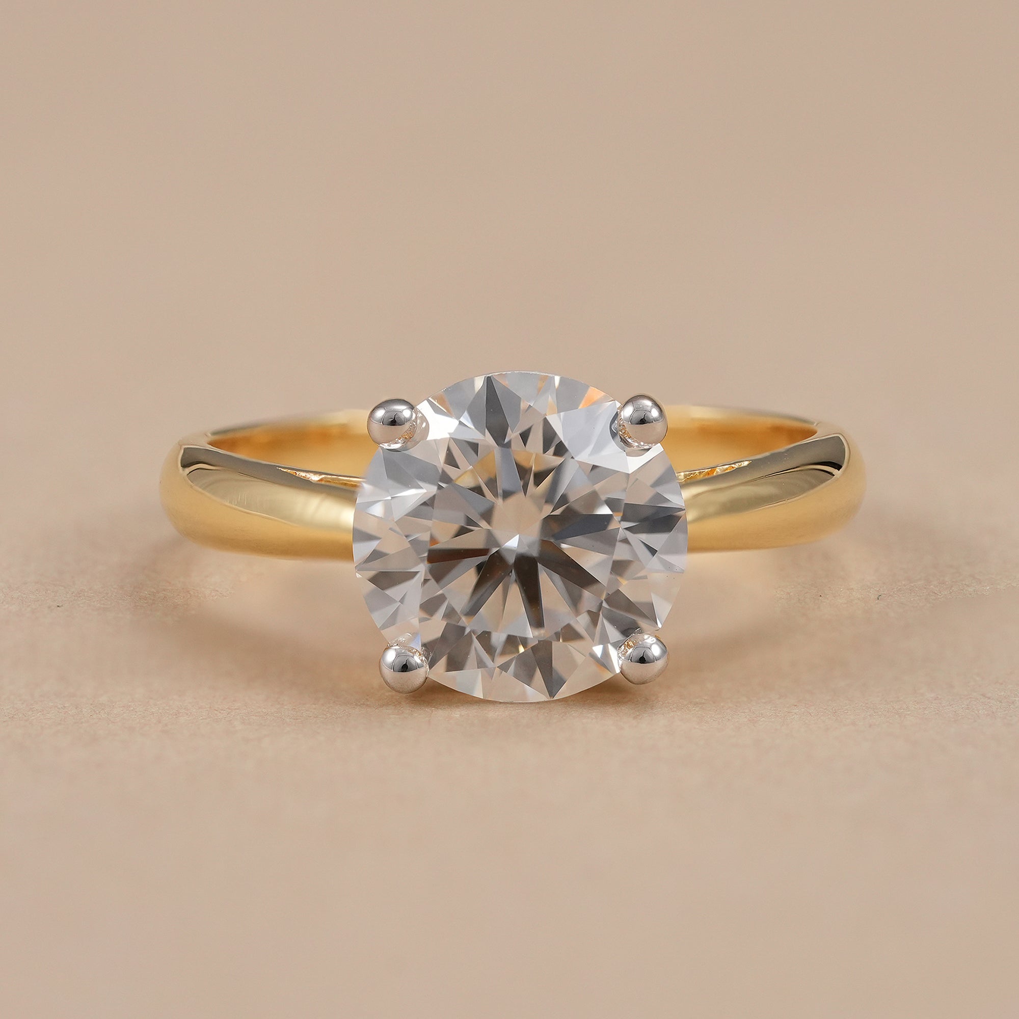 Round lab grown diamond solitaire engagement ring with cathedral setting