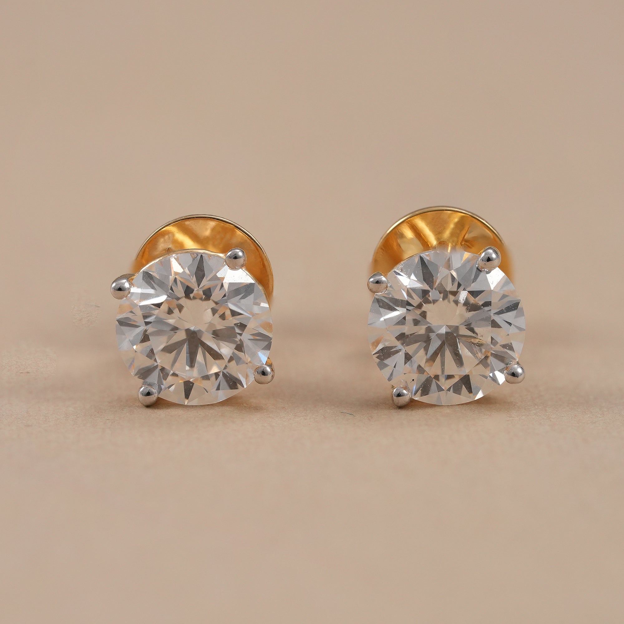Round lab grown diamond stud earrings with classic four prong setting