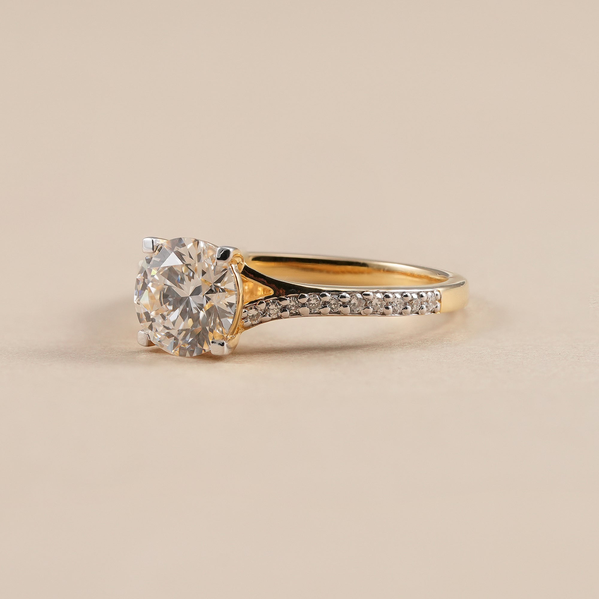 Four prong round lab diamond engagement ring in yellow gold