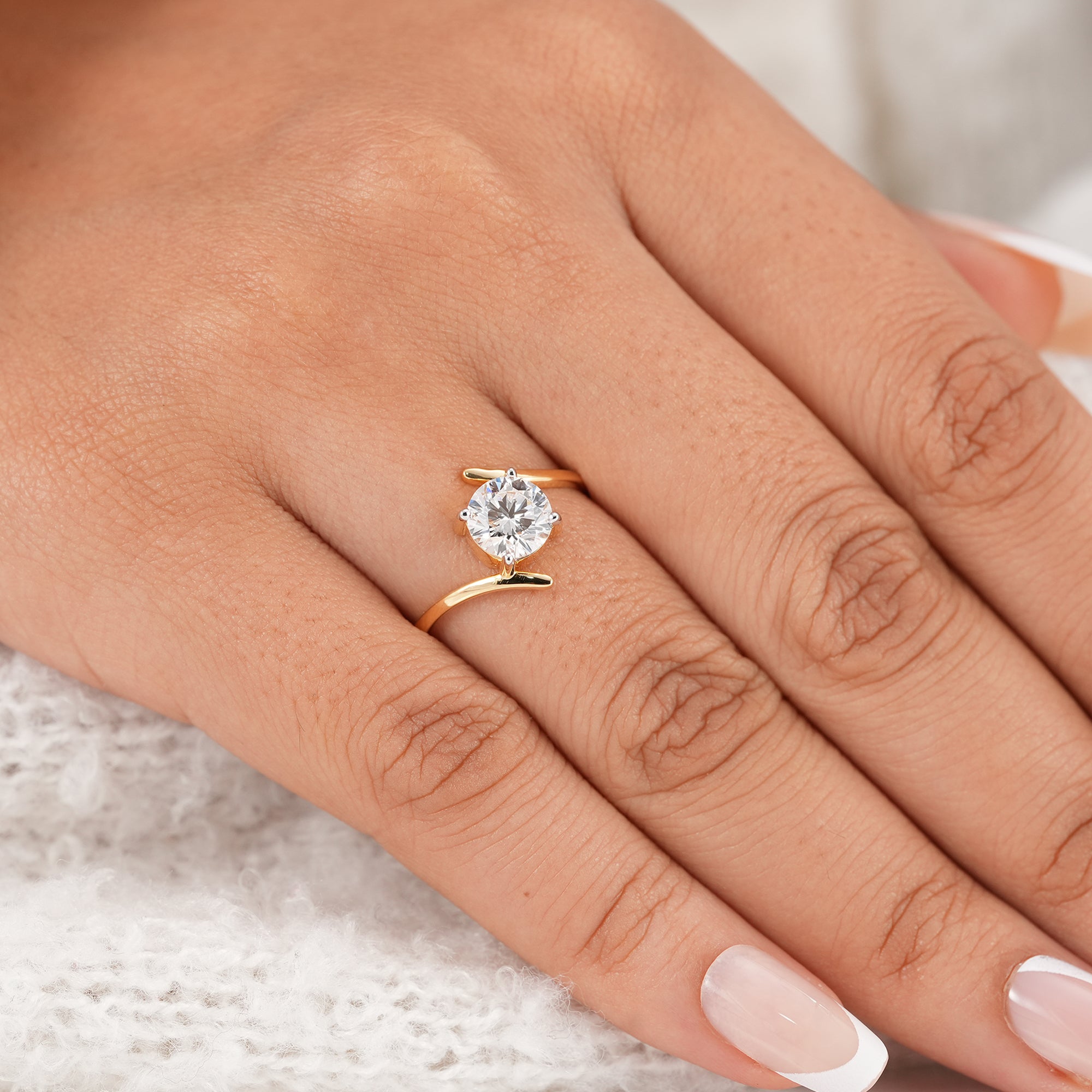 Modern round diamond engagement ring with split bypass design