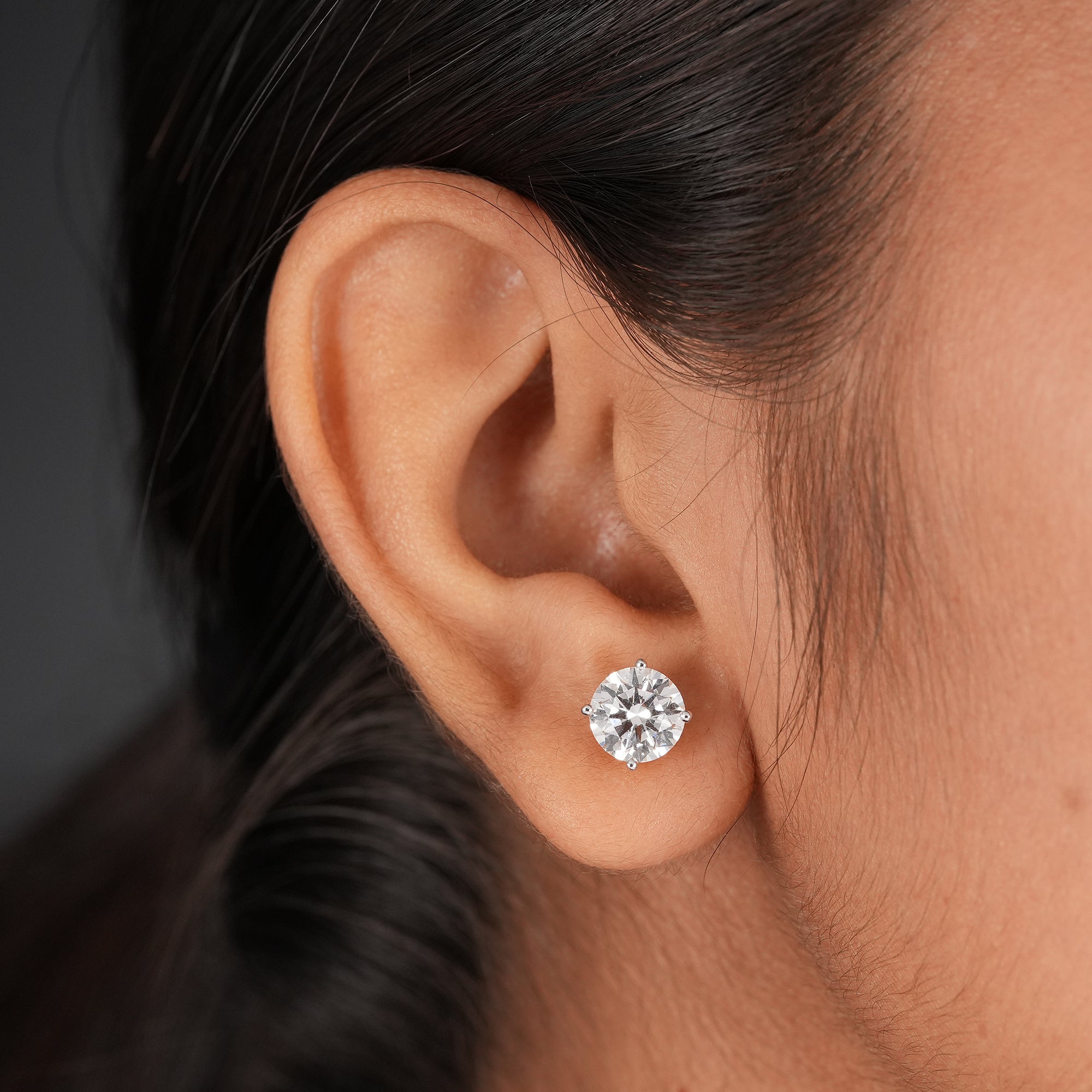 Round solitaire diamond studs crafted in fine gold jewelry