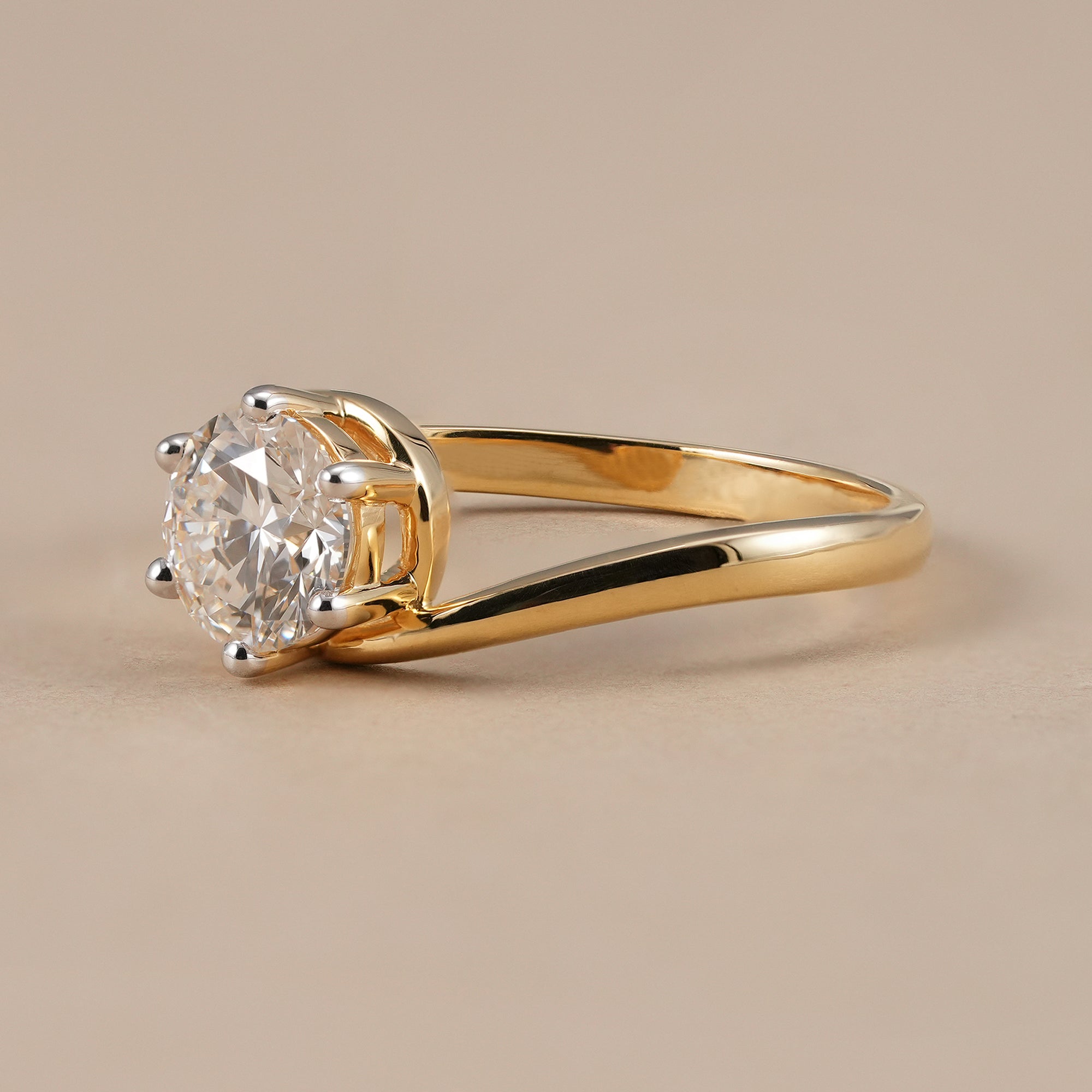 Twisted bypass solitaire round diamond engagement ring