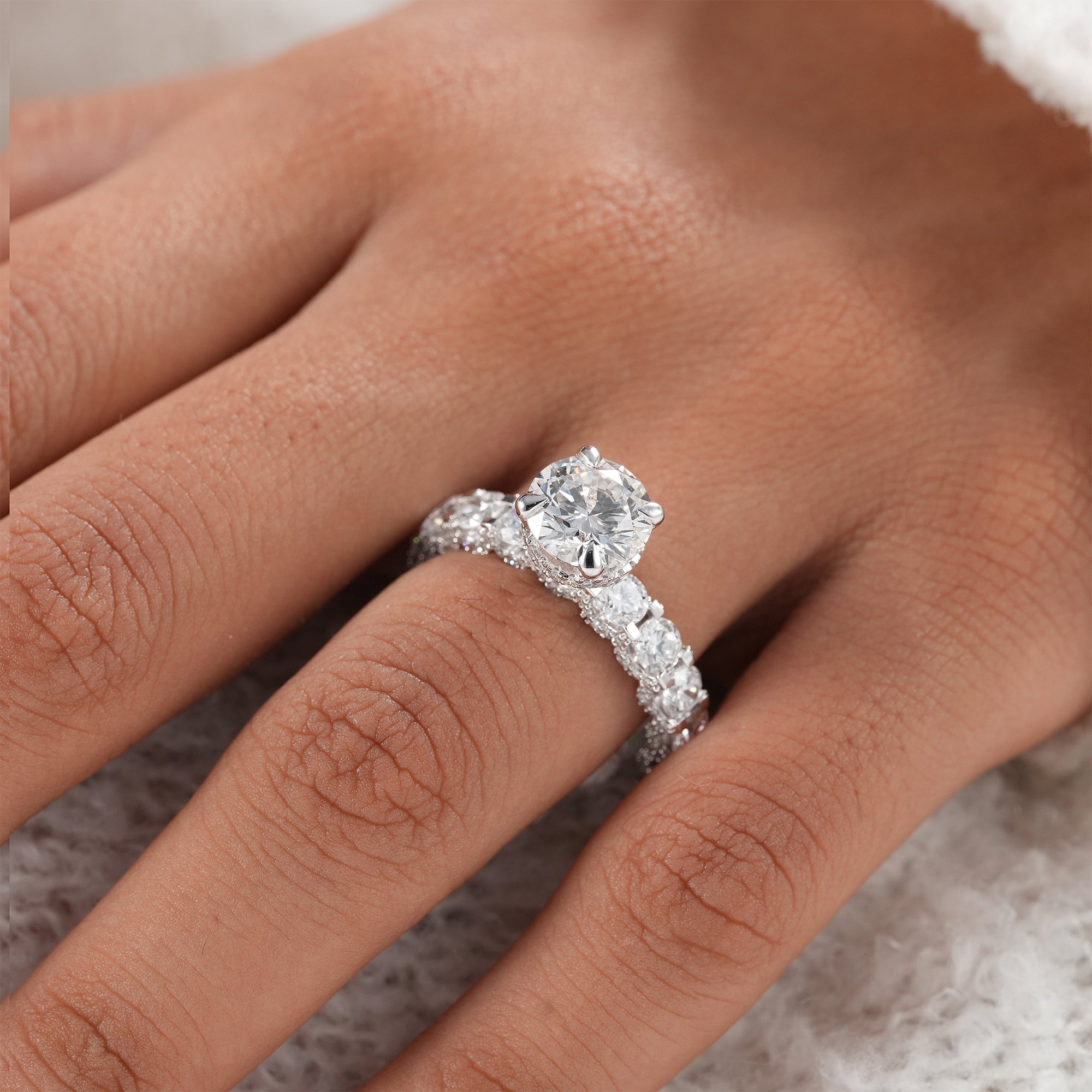 Sustainable round lab grown diamond engagement ring.