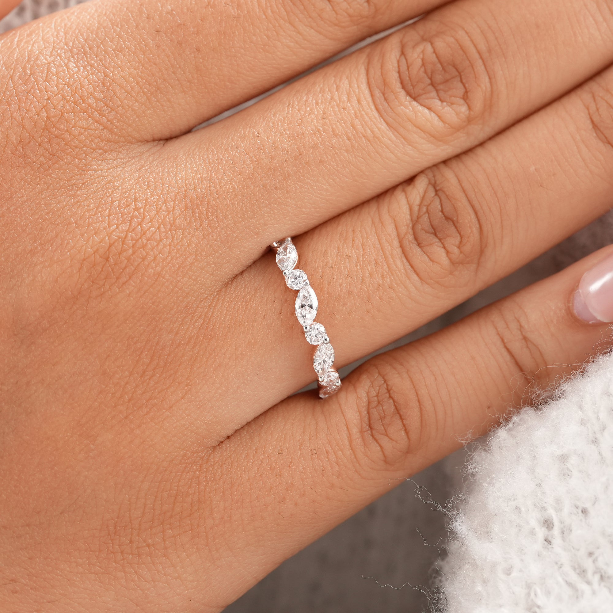 Delicate marquise diamond stacking ring for everyday wear.