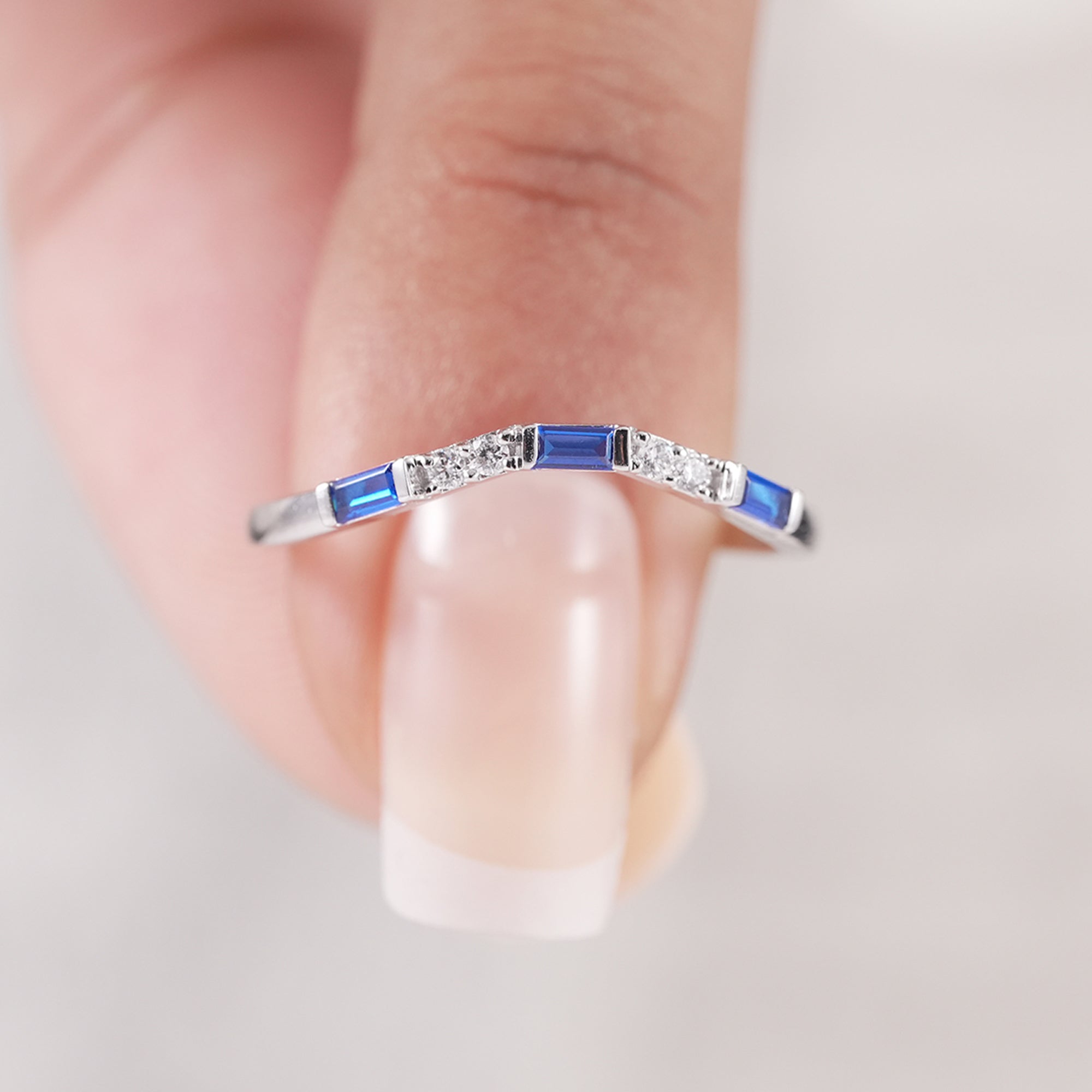 Modern curved diamond wedding ring with baguette stones