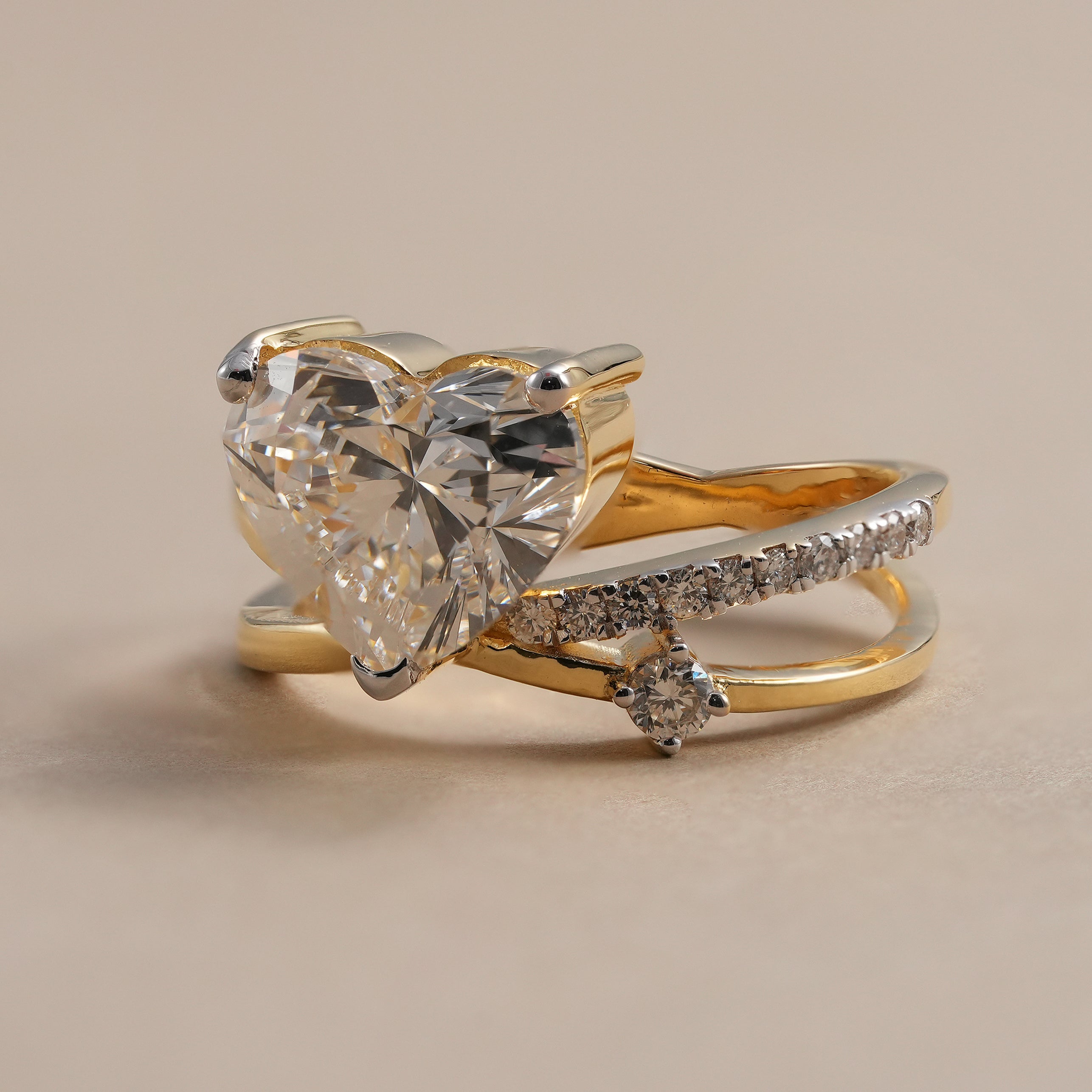 Heart diamond engagement ring with two tone gold bypass band