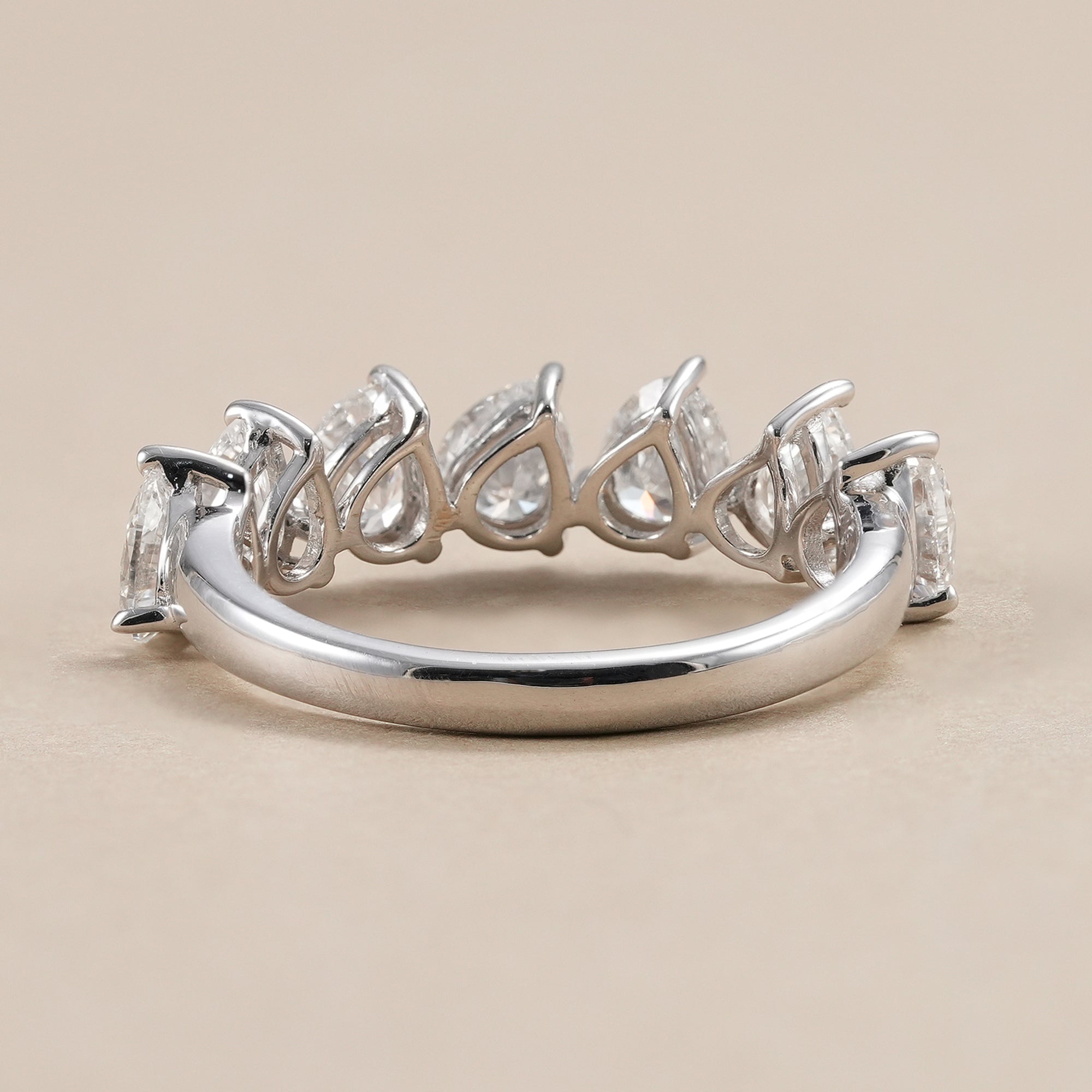 Elegant pear diamond wedding band handcrafted in white gold.