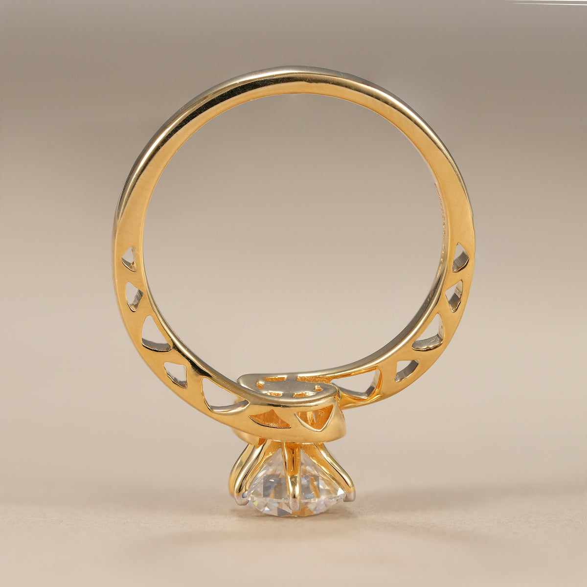 Sustainable lab grown diamond ring featuring a polished bypass design and brilliant round center stone.