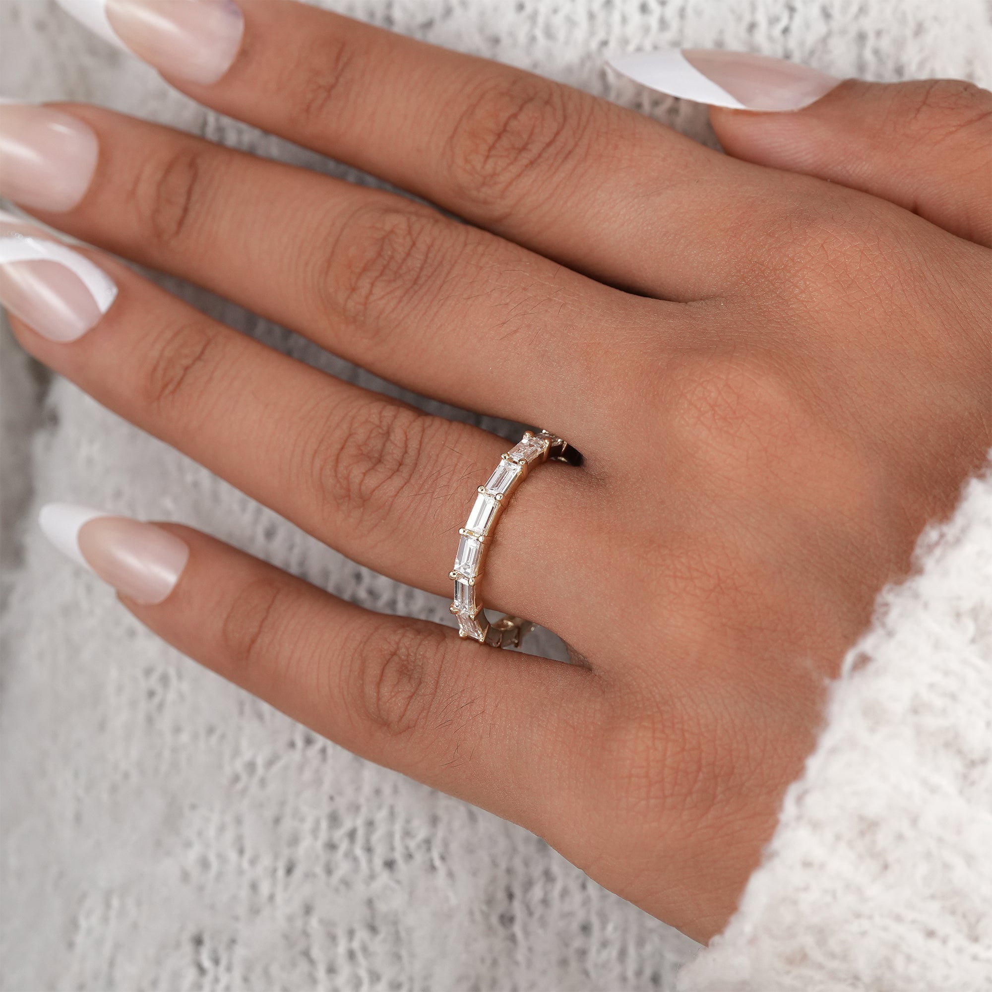 Modern bridal jewelry baguette diamond band.