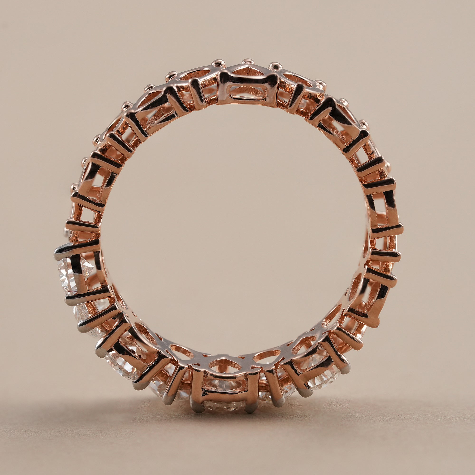 Lab grown pear diamond eternity wedding band with brilliant sparkle.