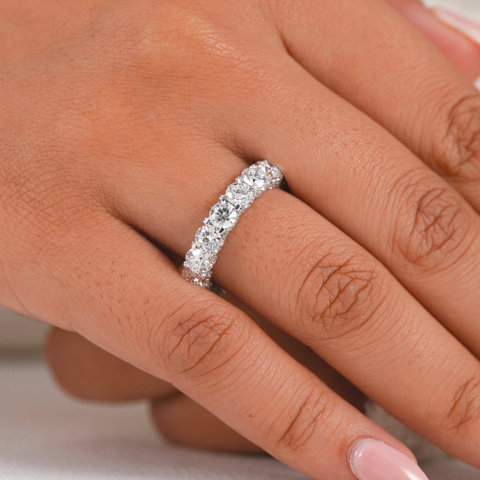 Round brilliant eternity band designed as a stackable bridal wedding ring with exceptional sparkle and brilliance.