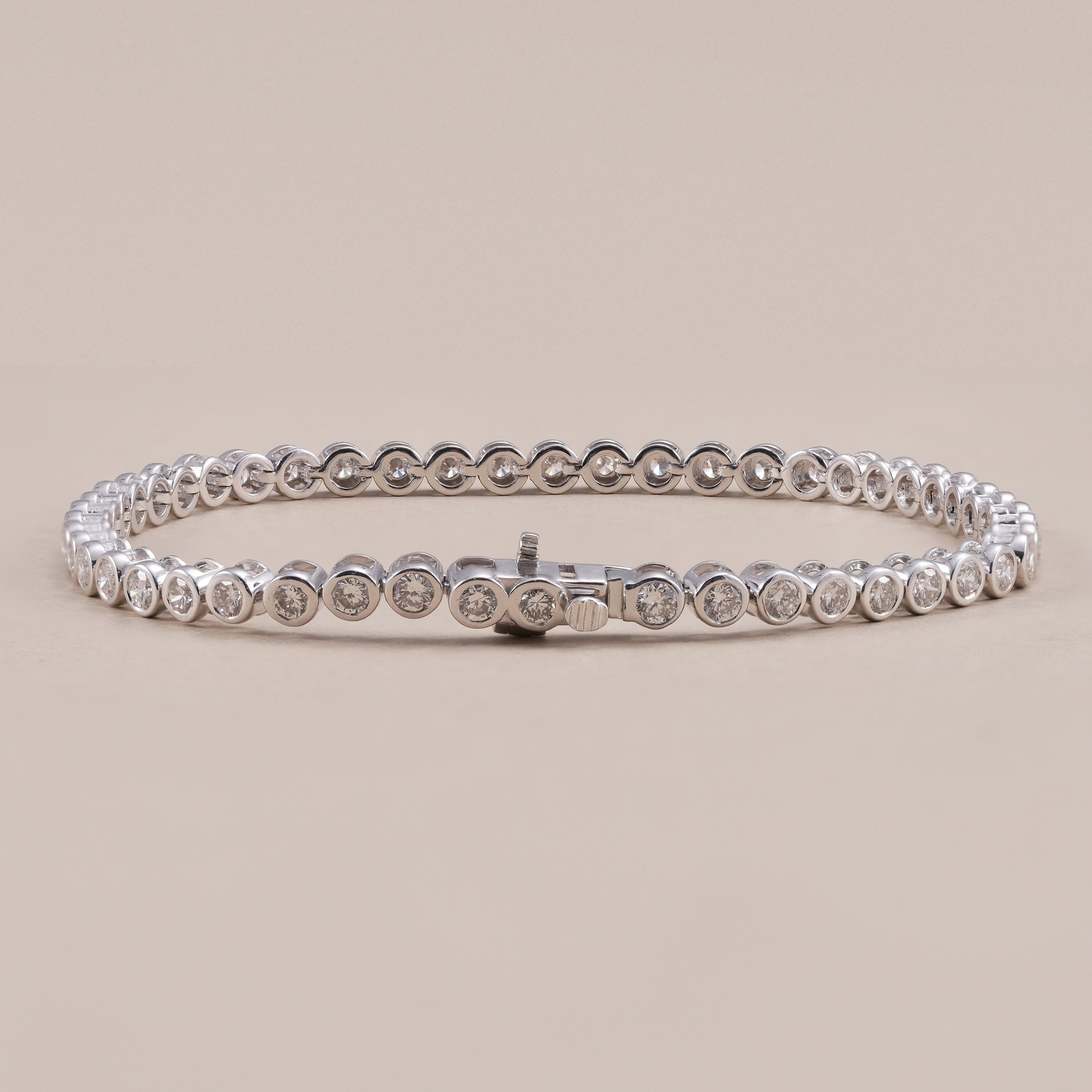 Fine jewelry diamond tennis bracelet featuring round cut diamonds.