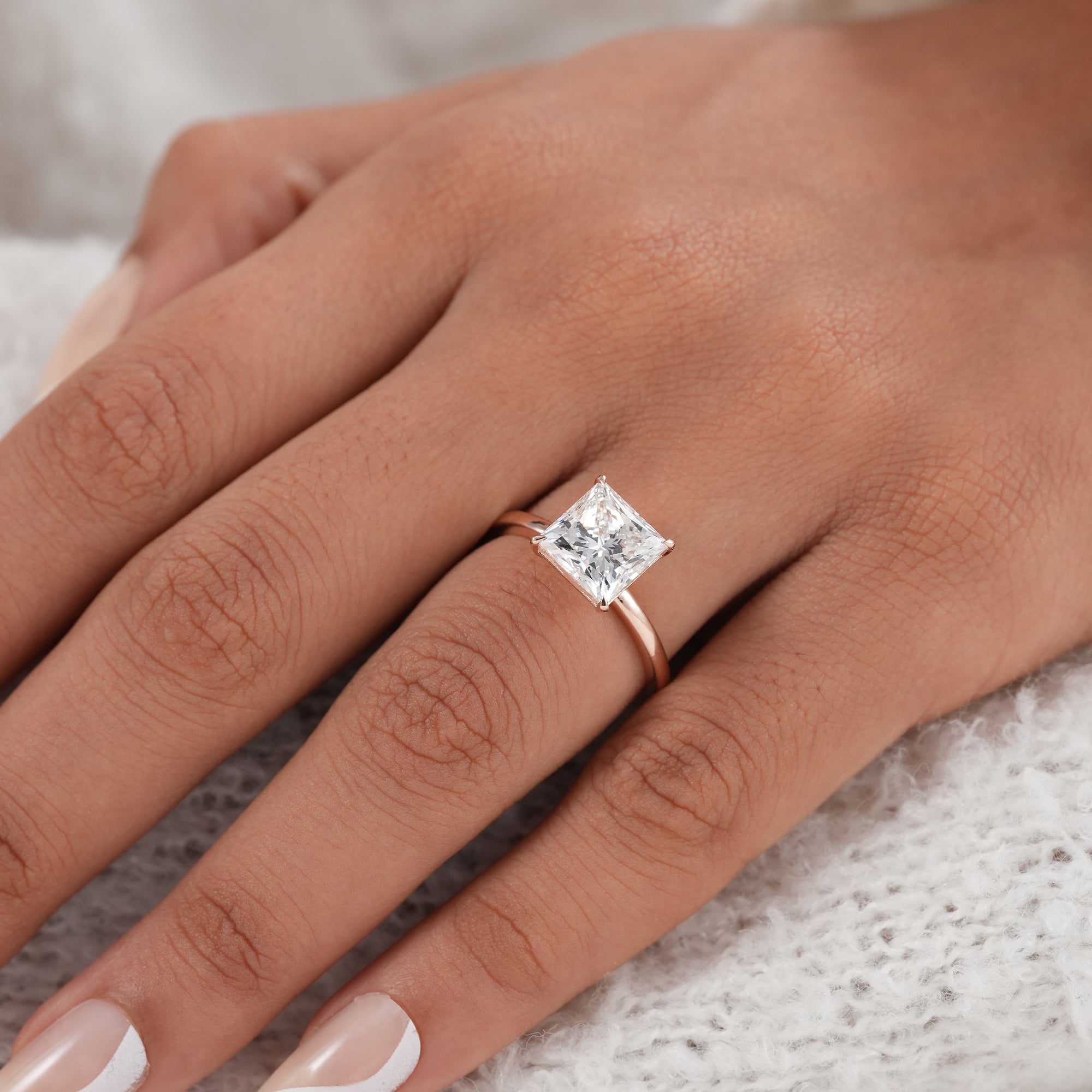 Four prong princess cut lab diamond ring handcrafted in gold.