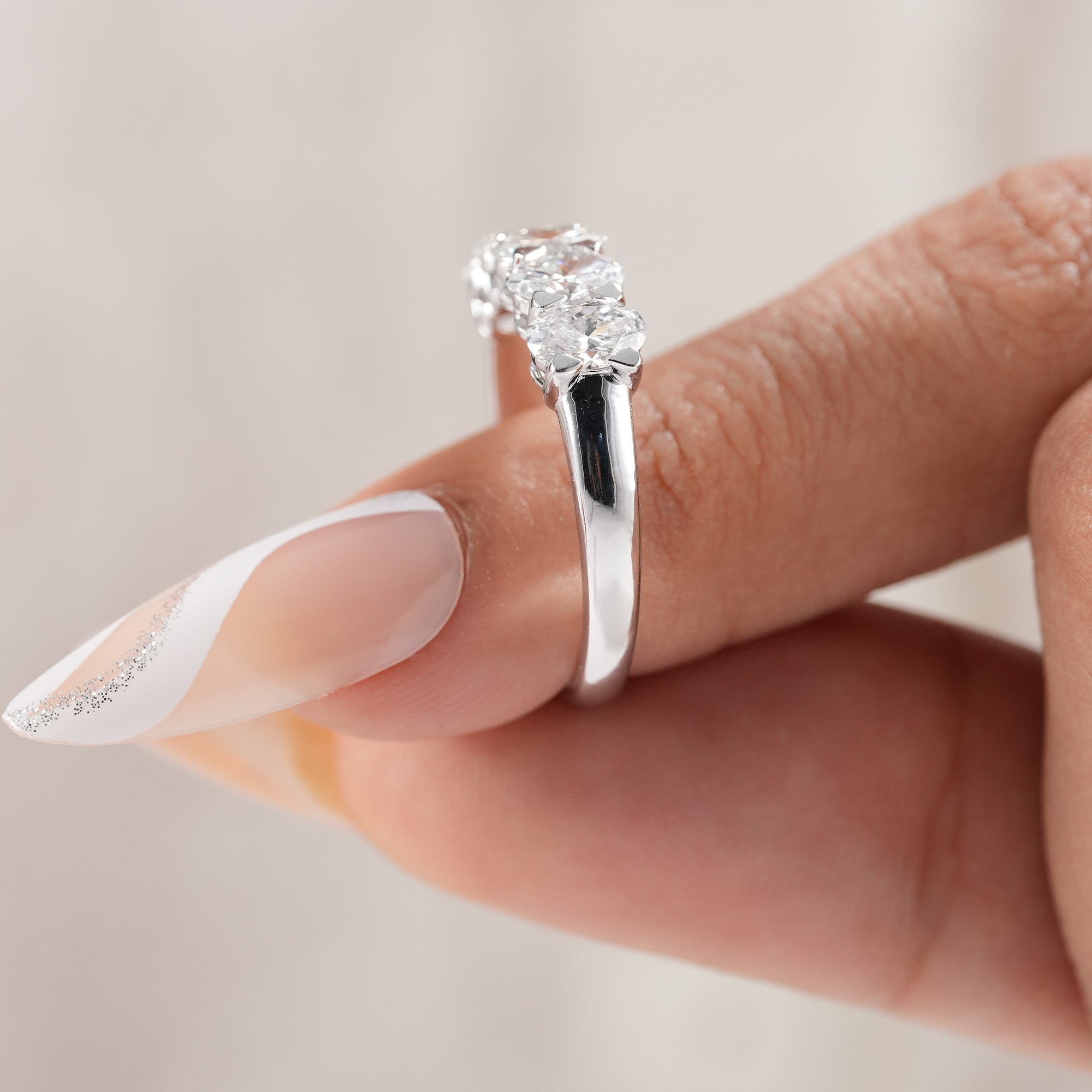 Classic five stone oval lab diamond ring for everyday wear.