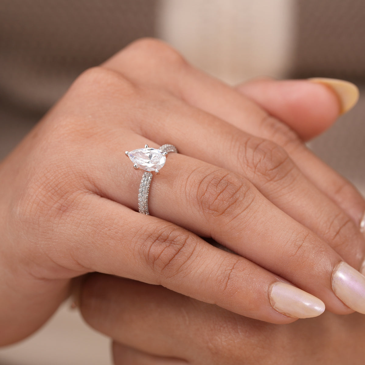 Modern pear cut diamond ring designed for bridal, proposal, promise, and anniversary occasions.