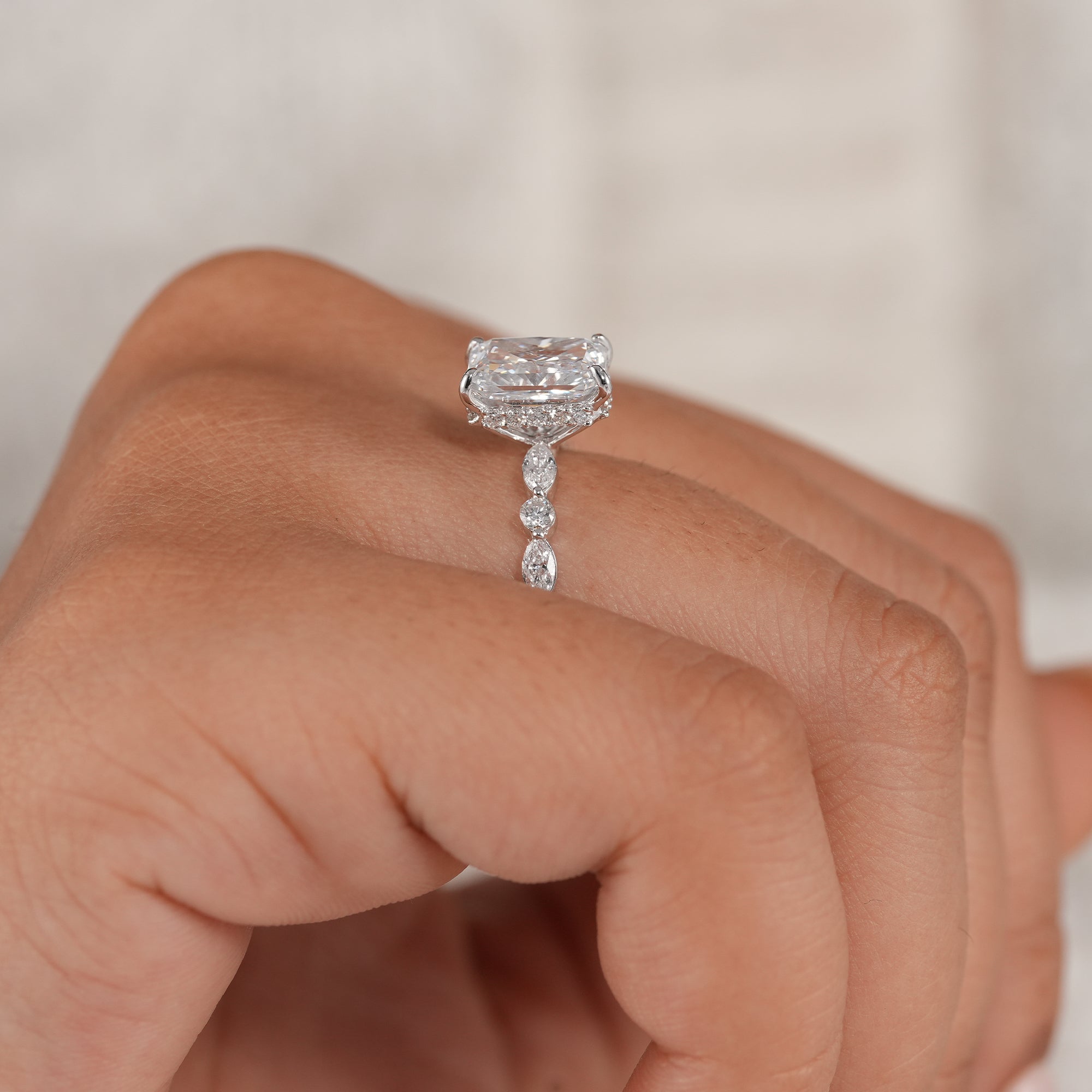 Elegant bridal ring featuring marquise and round diamonds.