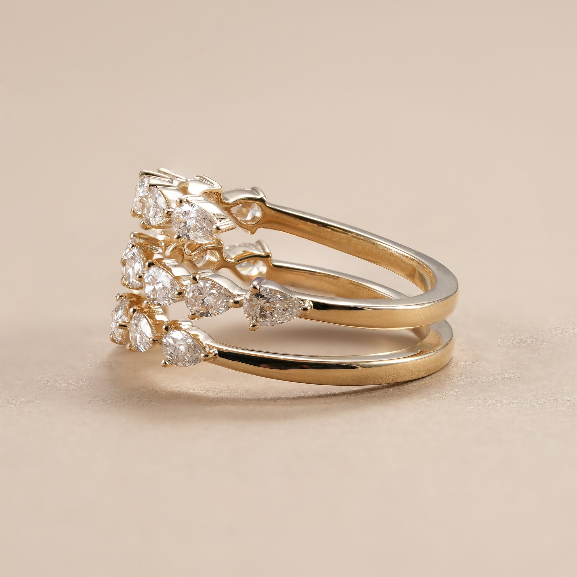 Open wrap pear diamond wedding band for women.