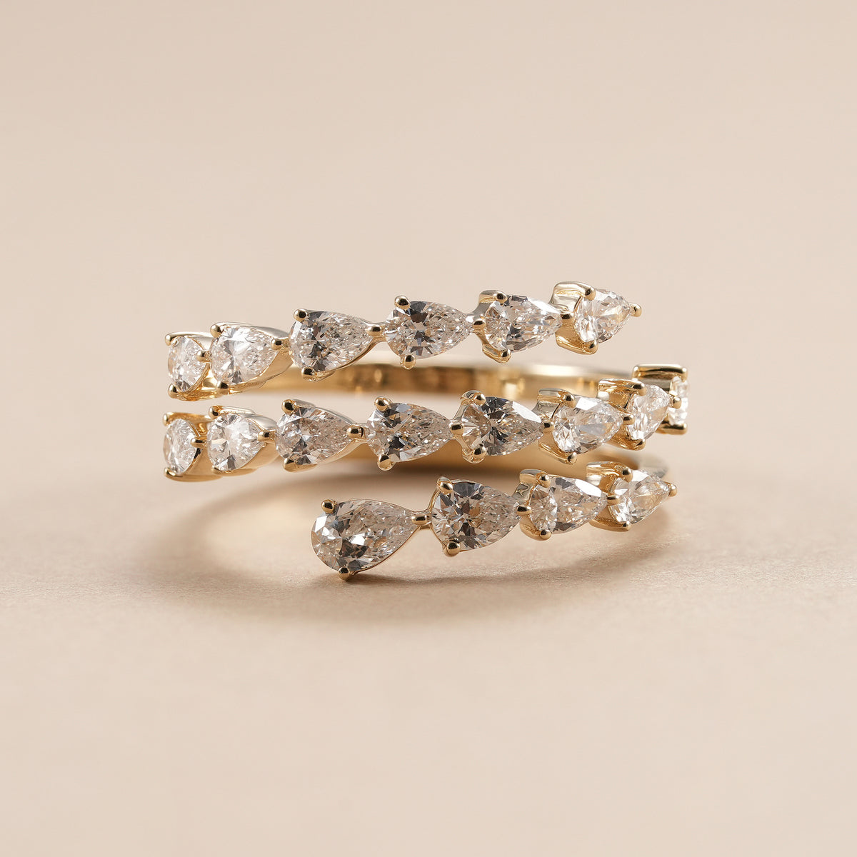 Three row pear lab grown diamond wedding band in yellow gold.