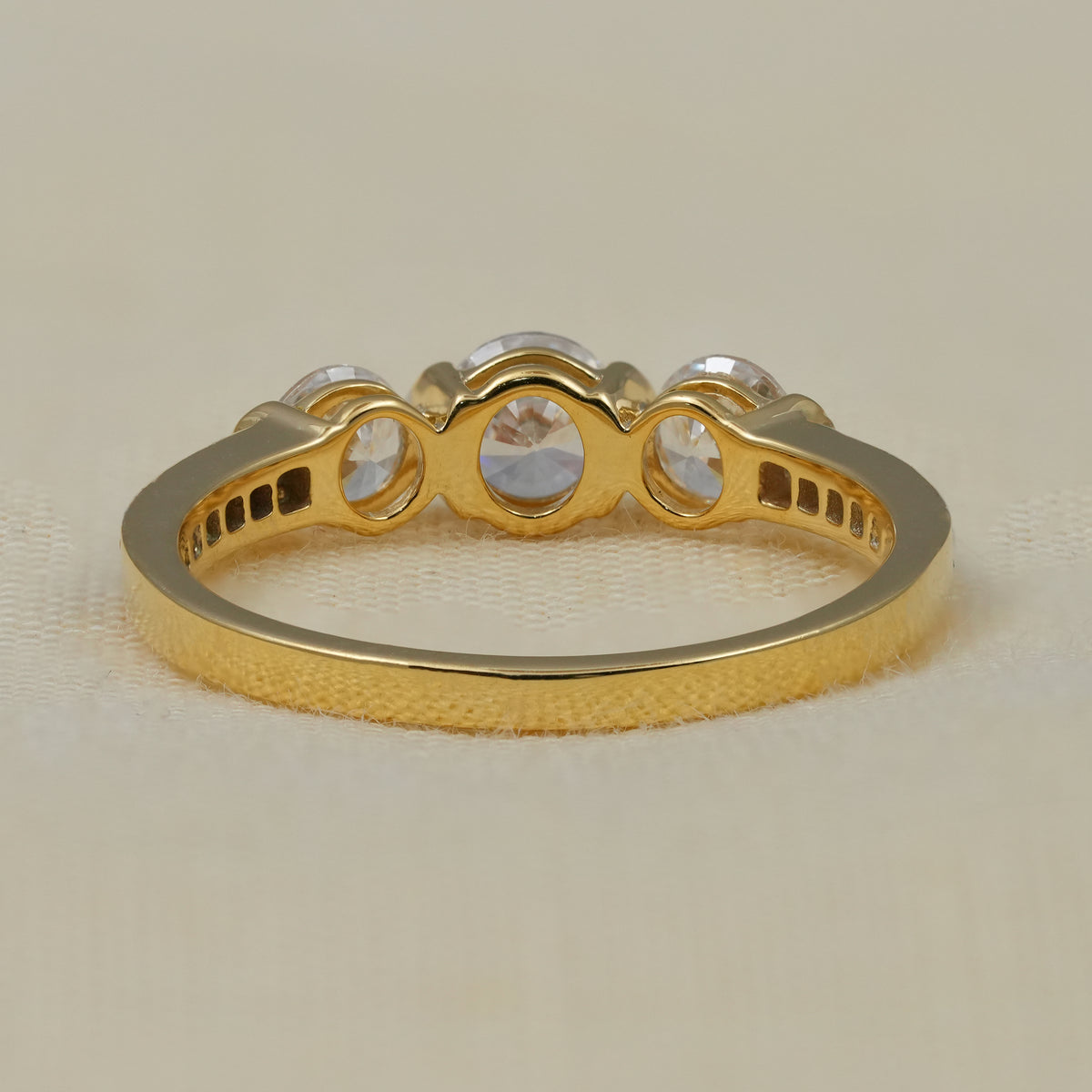 Classic three stone anniversary ring featuring brilliant round lab diamonds.