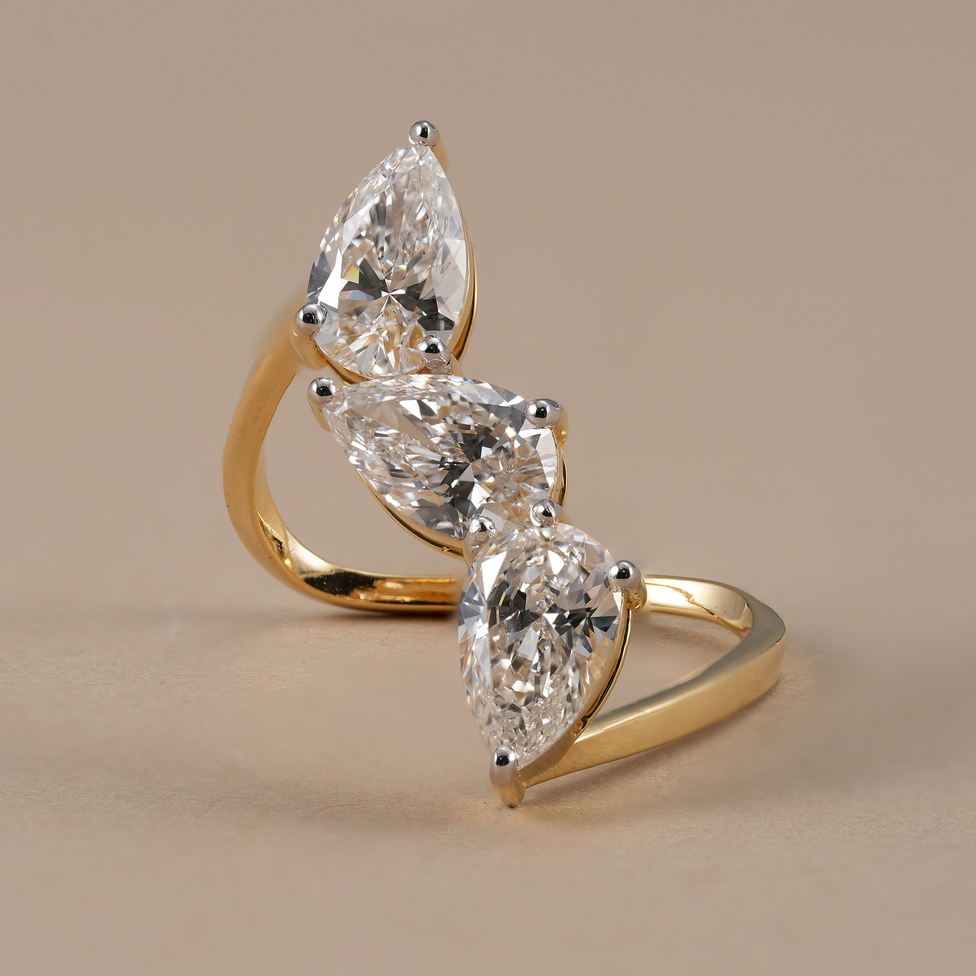 Three stone pear lab grown diamond wedding ring in yellow gold