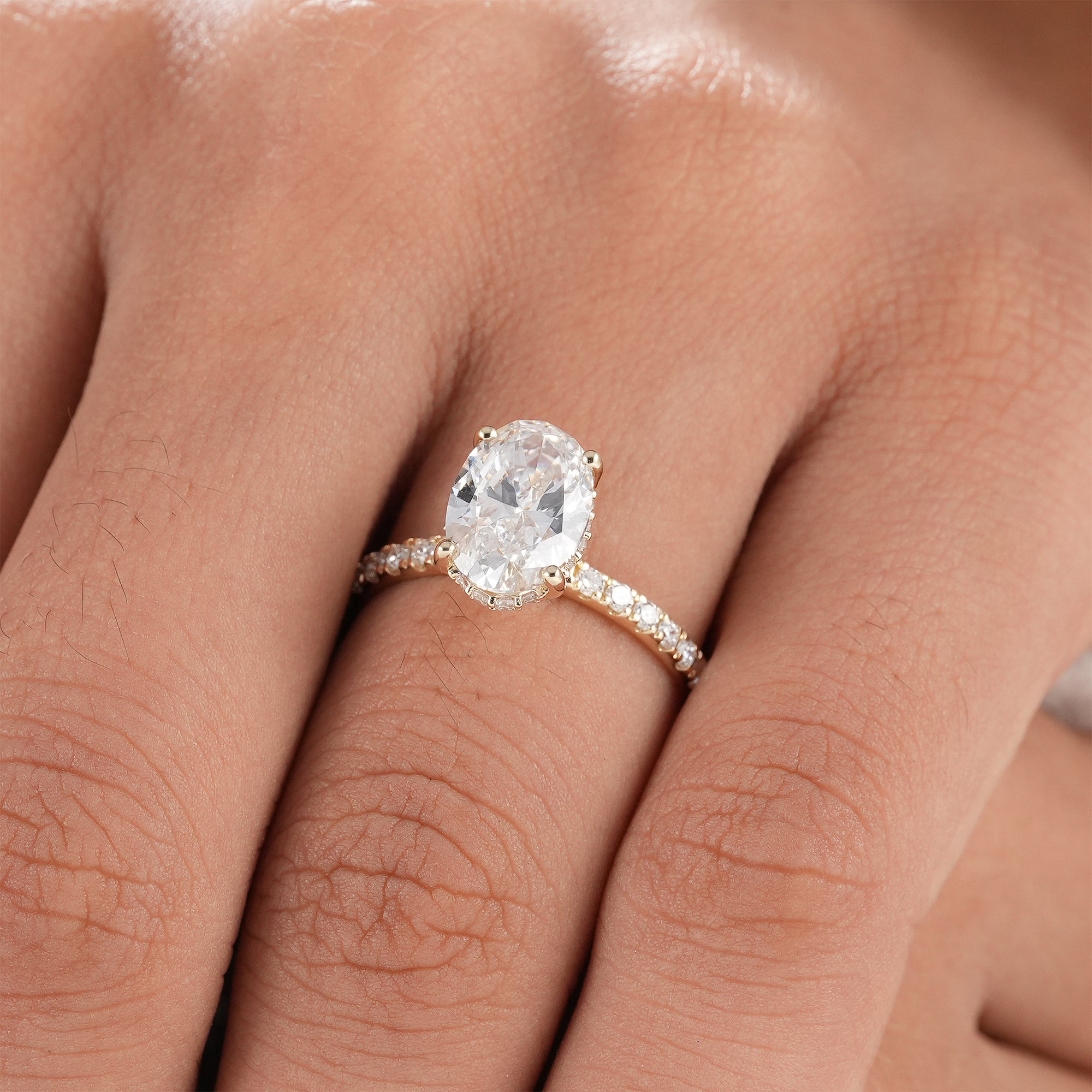 Modern oval engagement ring with IGI certified lab diamond.