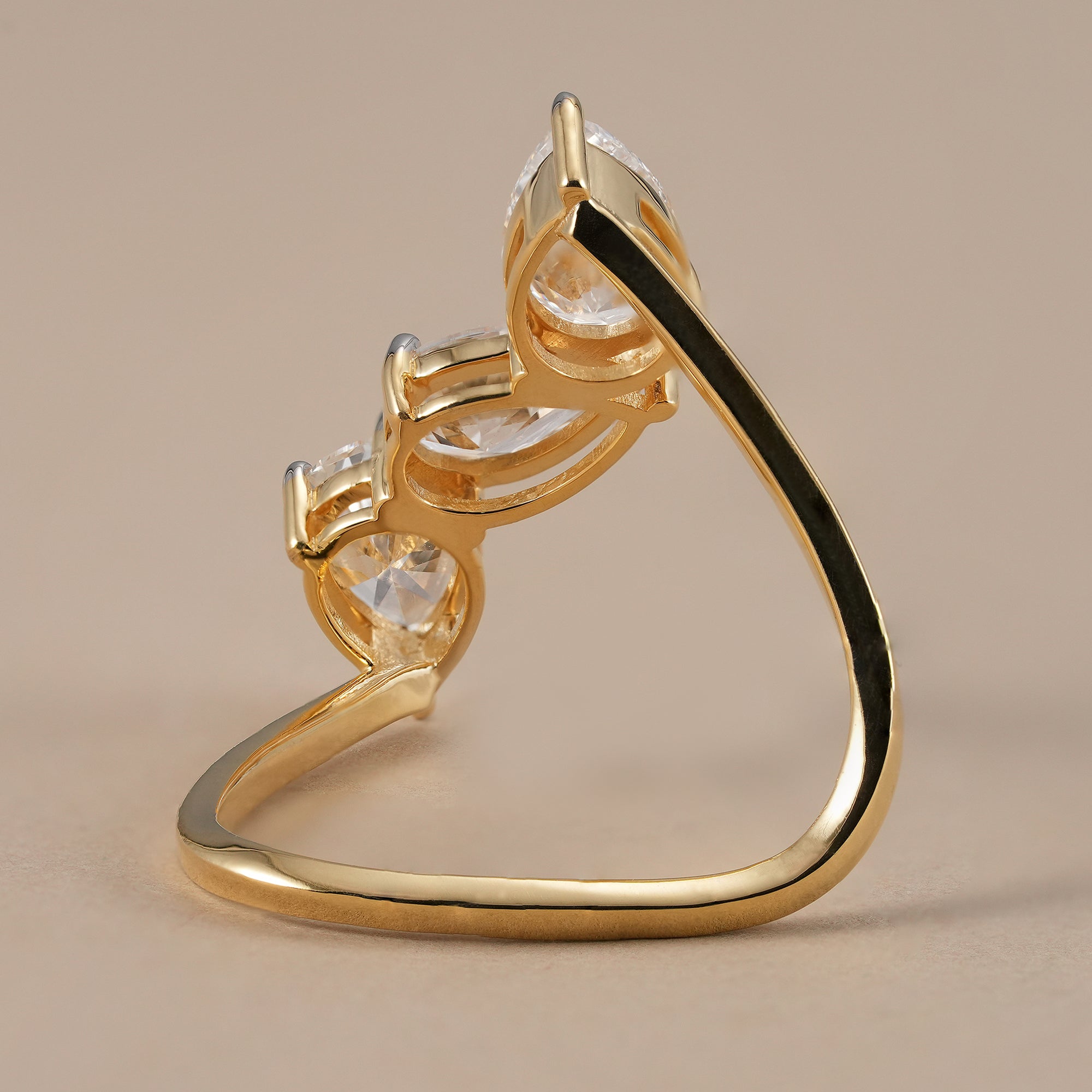Elegant pear diamond bridal ring with three stones