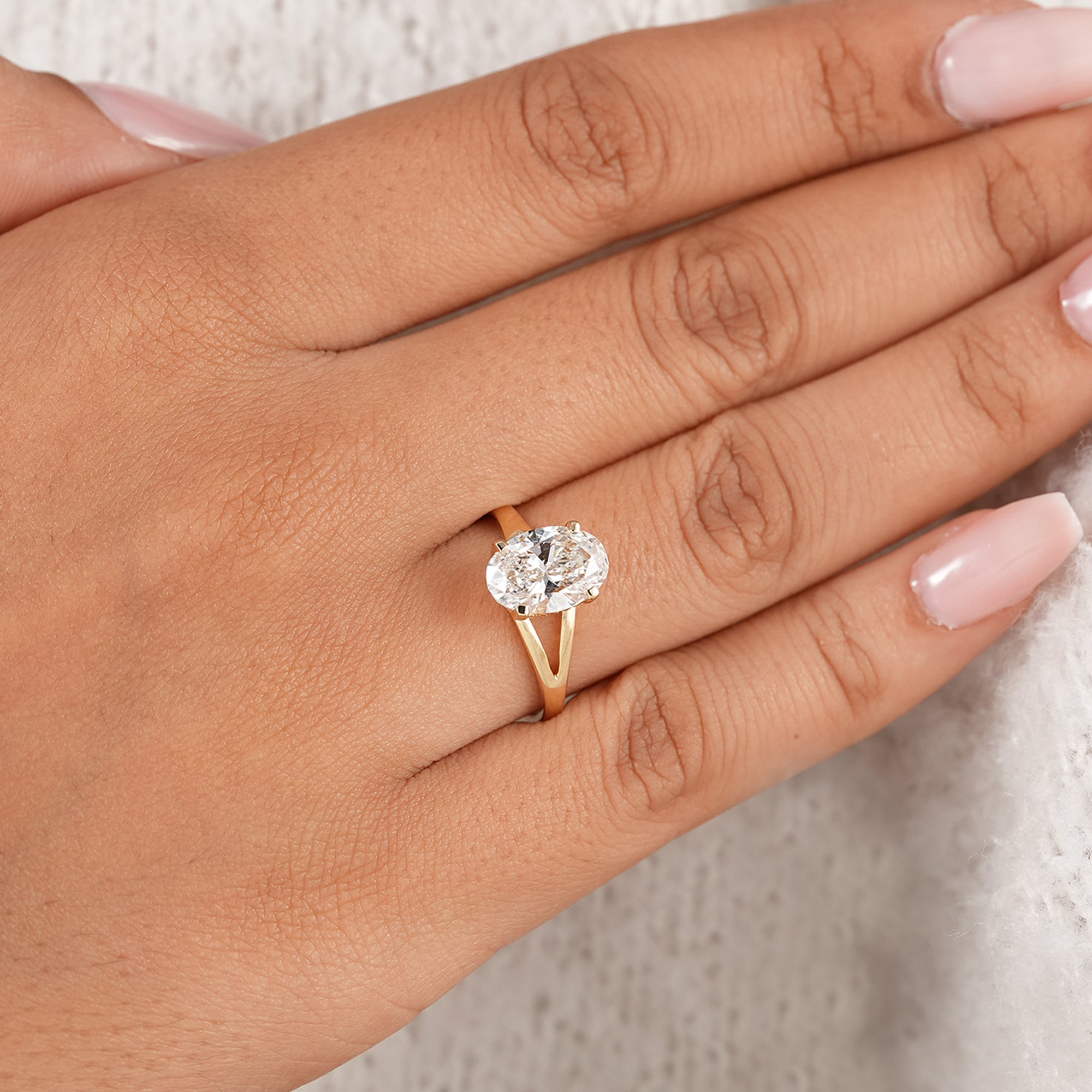 Minimalist oval engagement ring in solid gold