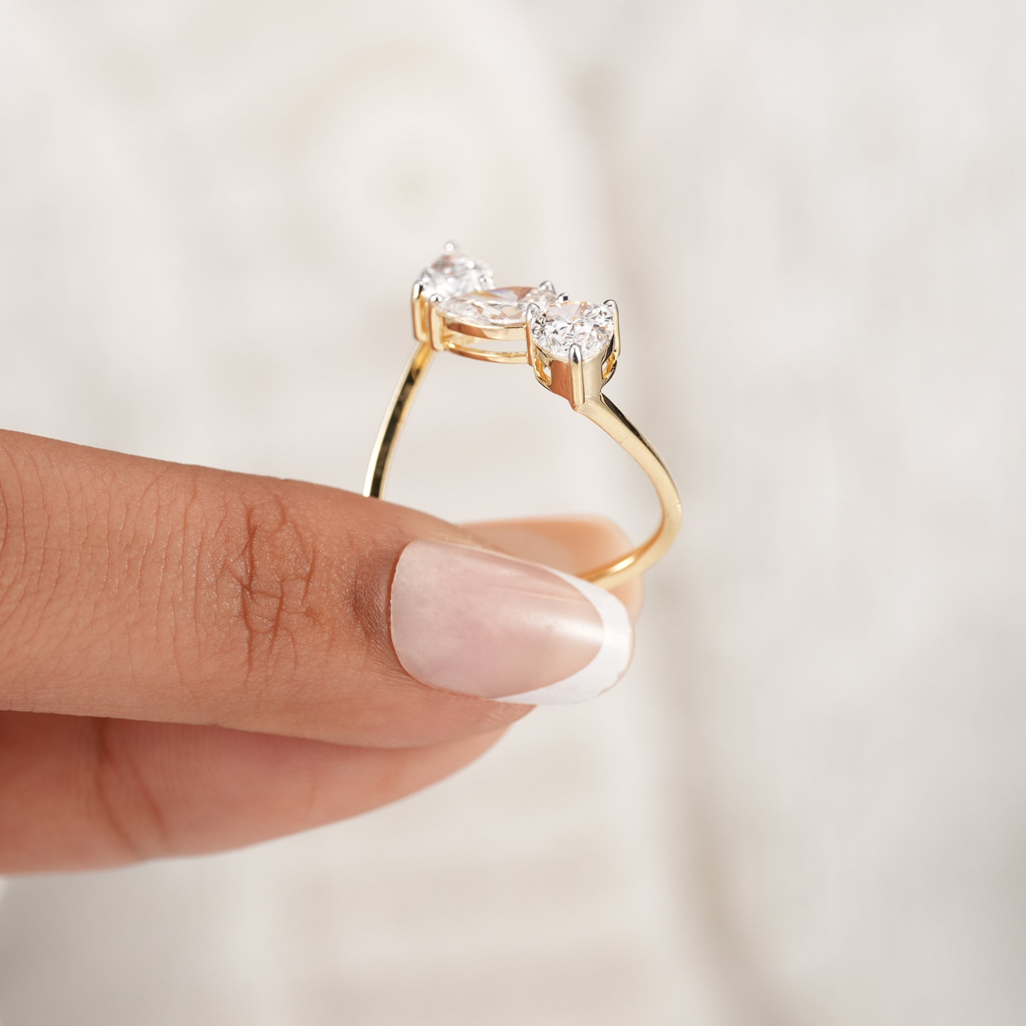 Sustainable three stone pear lab diamond ring